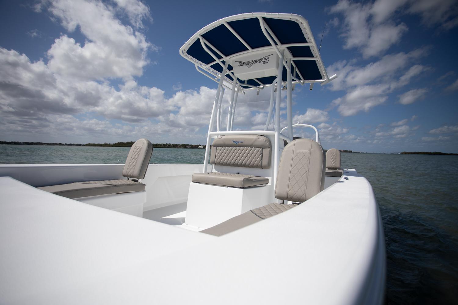 Manufacturer Provided Image: Savannah SS21 boat 2025 on calm water under blue sky.