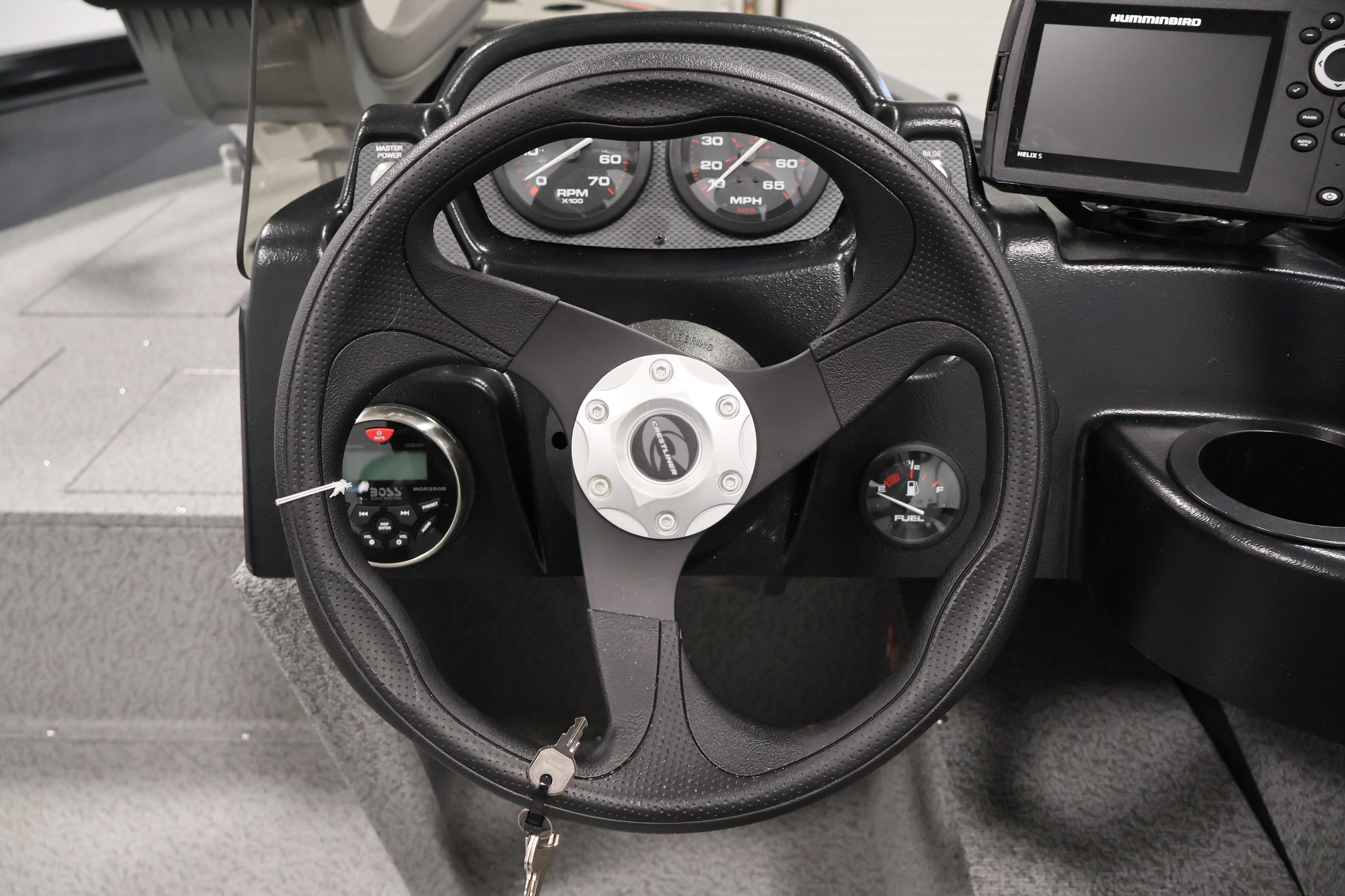 Steering wheel and dashboard of 2026 Crestliner 1850 Kodiak SC boat.