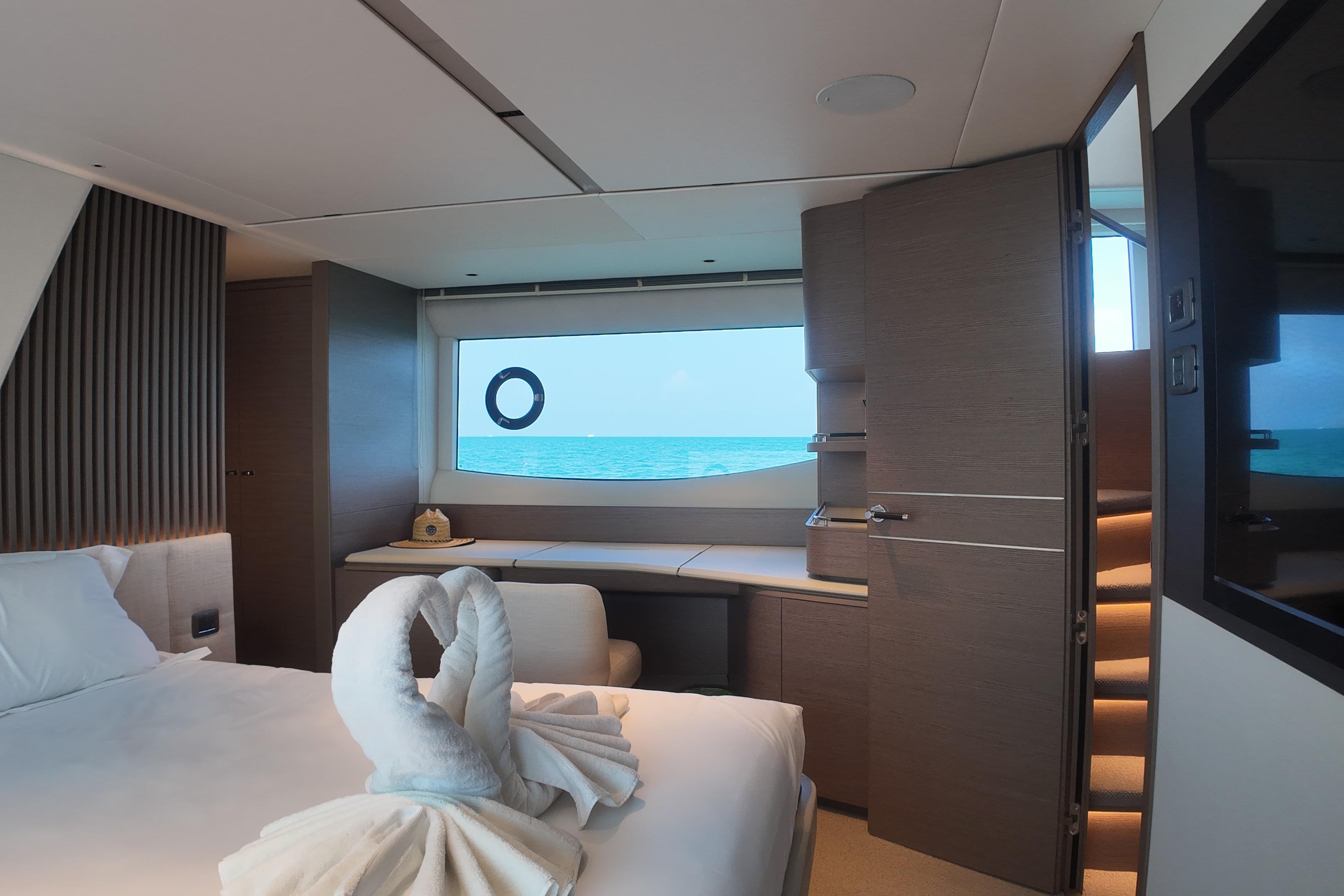 Luxurious 2023 Princess Y72 yacht cabin with ocean view and elegant decor.