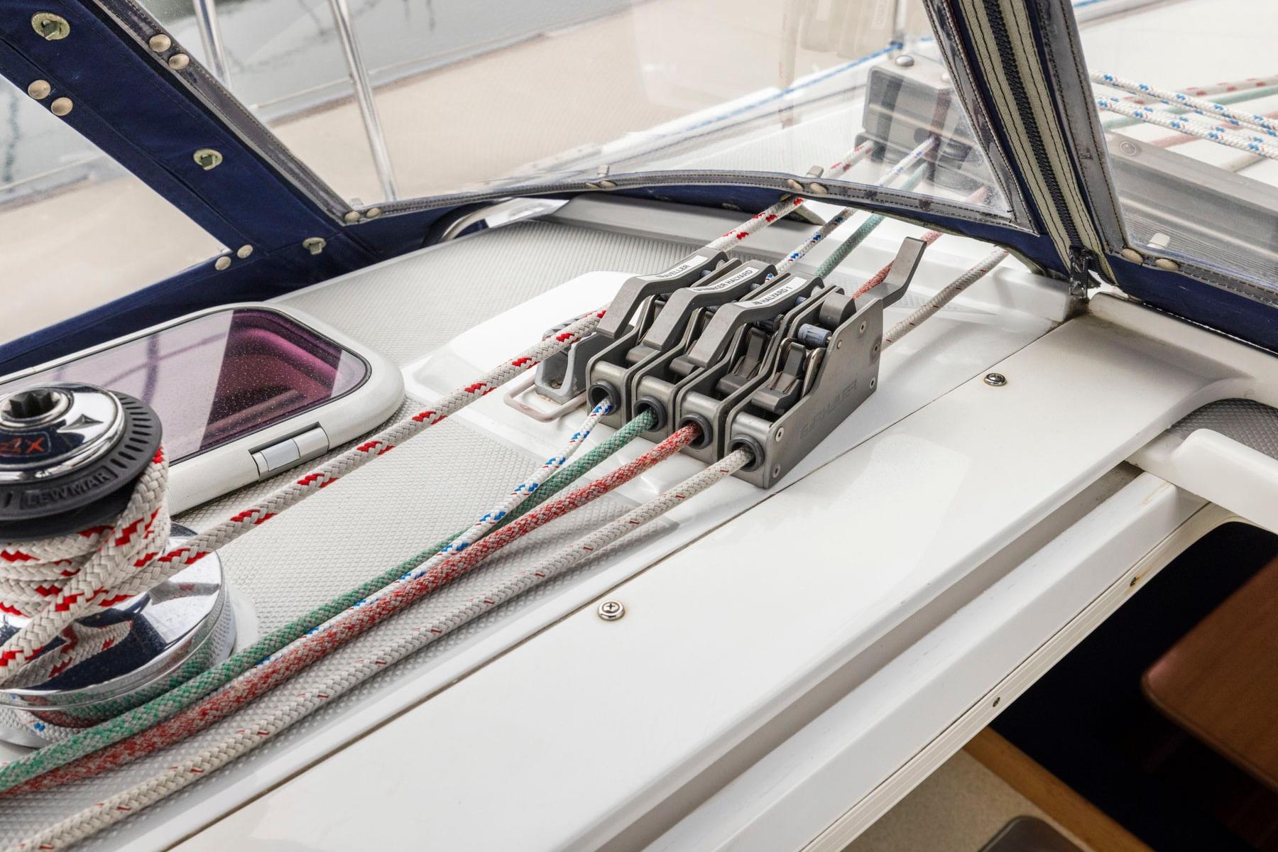 Sailing controls on a 2004 Catalina 36 MkII yacht, featuring winches and rope clutches.