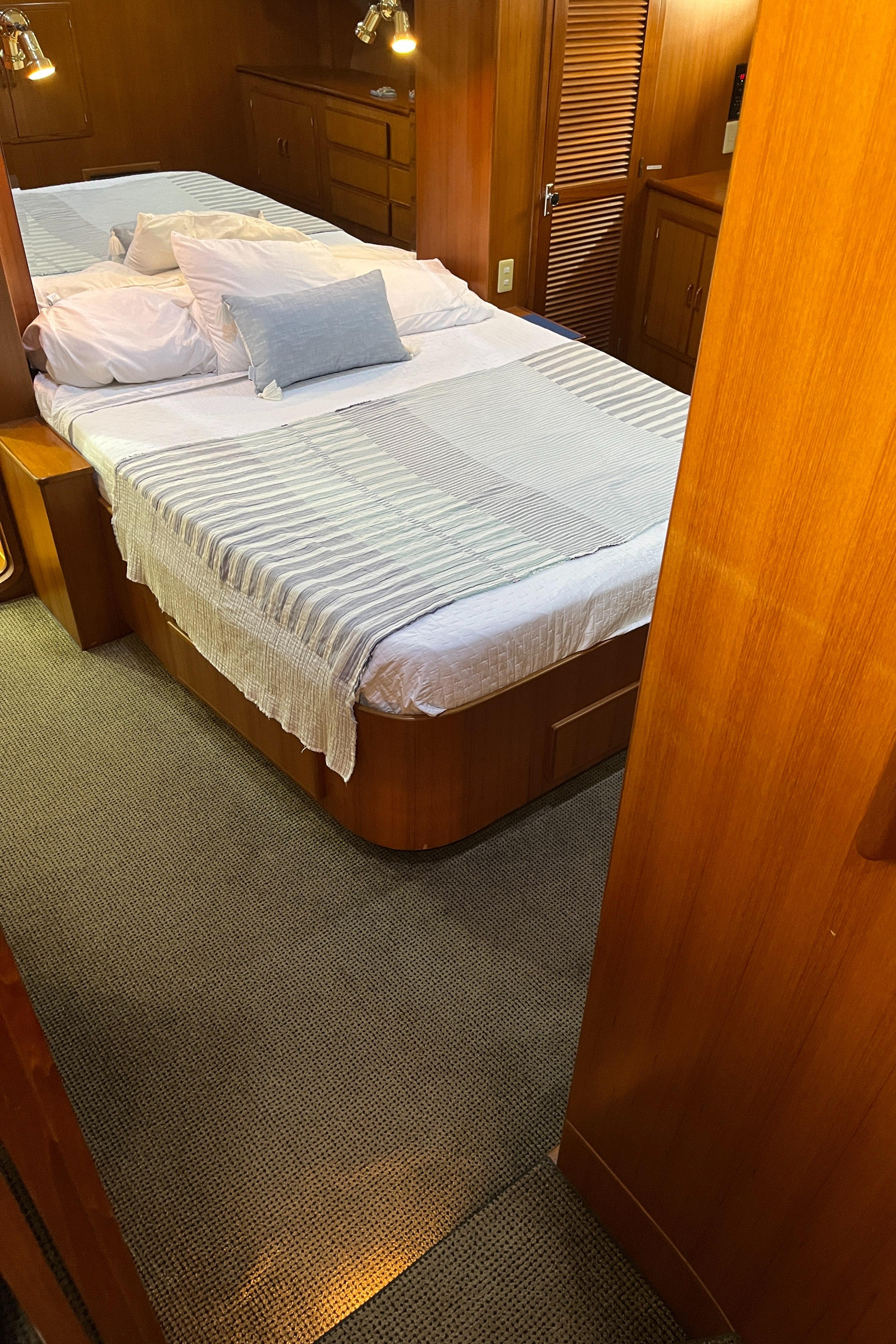 Luxurious bedroom interior of 1999 Mikelson Long-Range Luxury Sportfisher yacht.