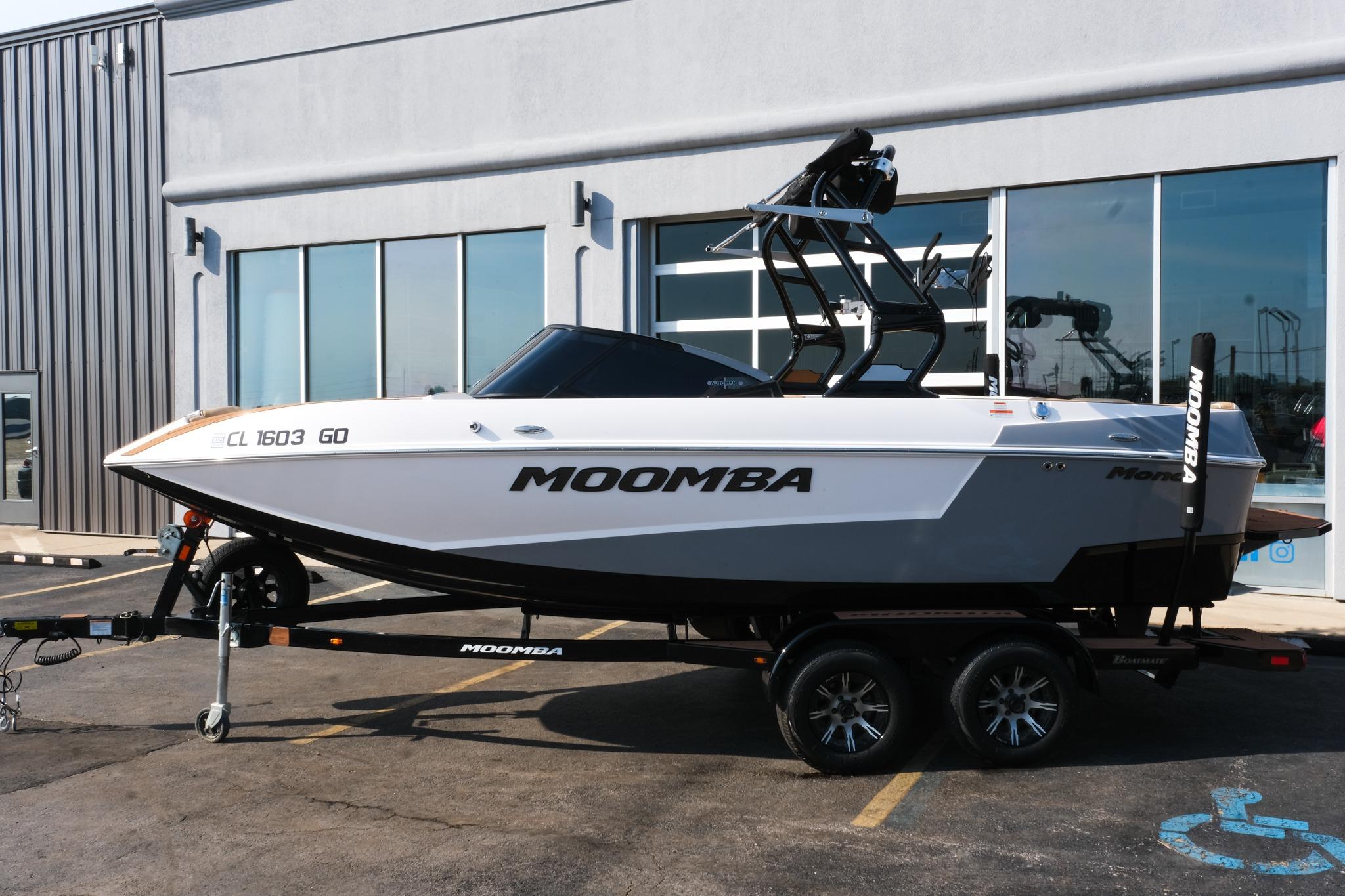 2023 Moomba Mondo boat on trailer outside a building.
