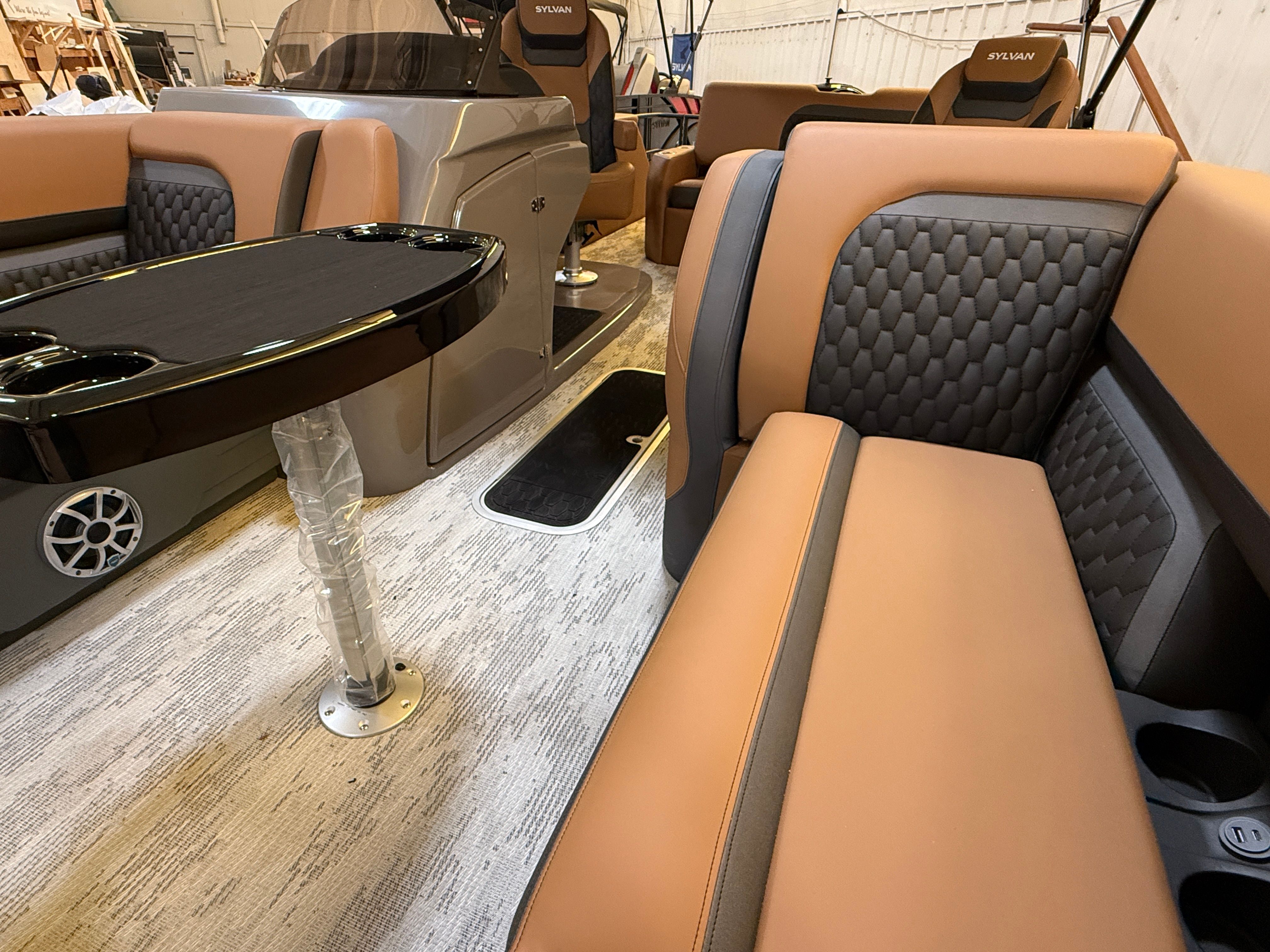 Interior of a 2026 Sylvan L3 ULZ DH with sleek seating and a table.