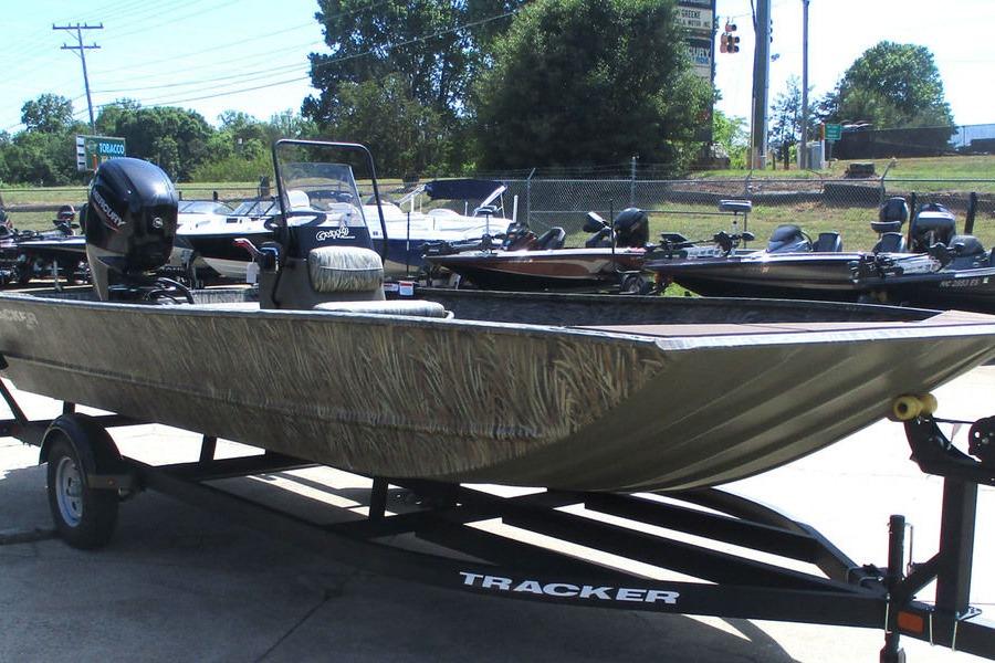 2026 Tracker Grizzly 2072 CC boat on trailer, parked outdoors in a dealership lot.
