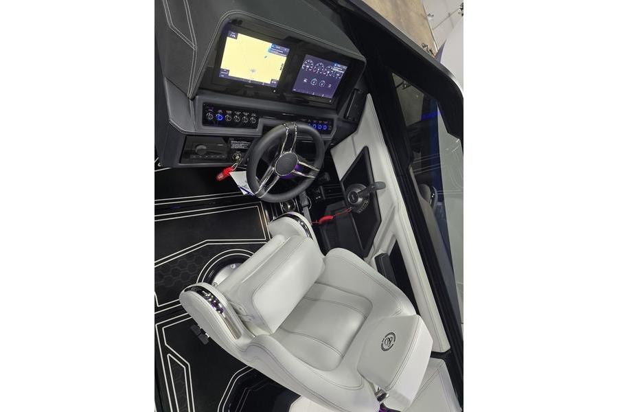 2026 Cobalt R8 Surf boat cockpit with modern steering and digital displays.