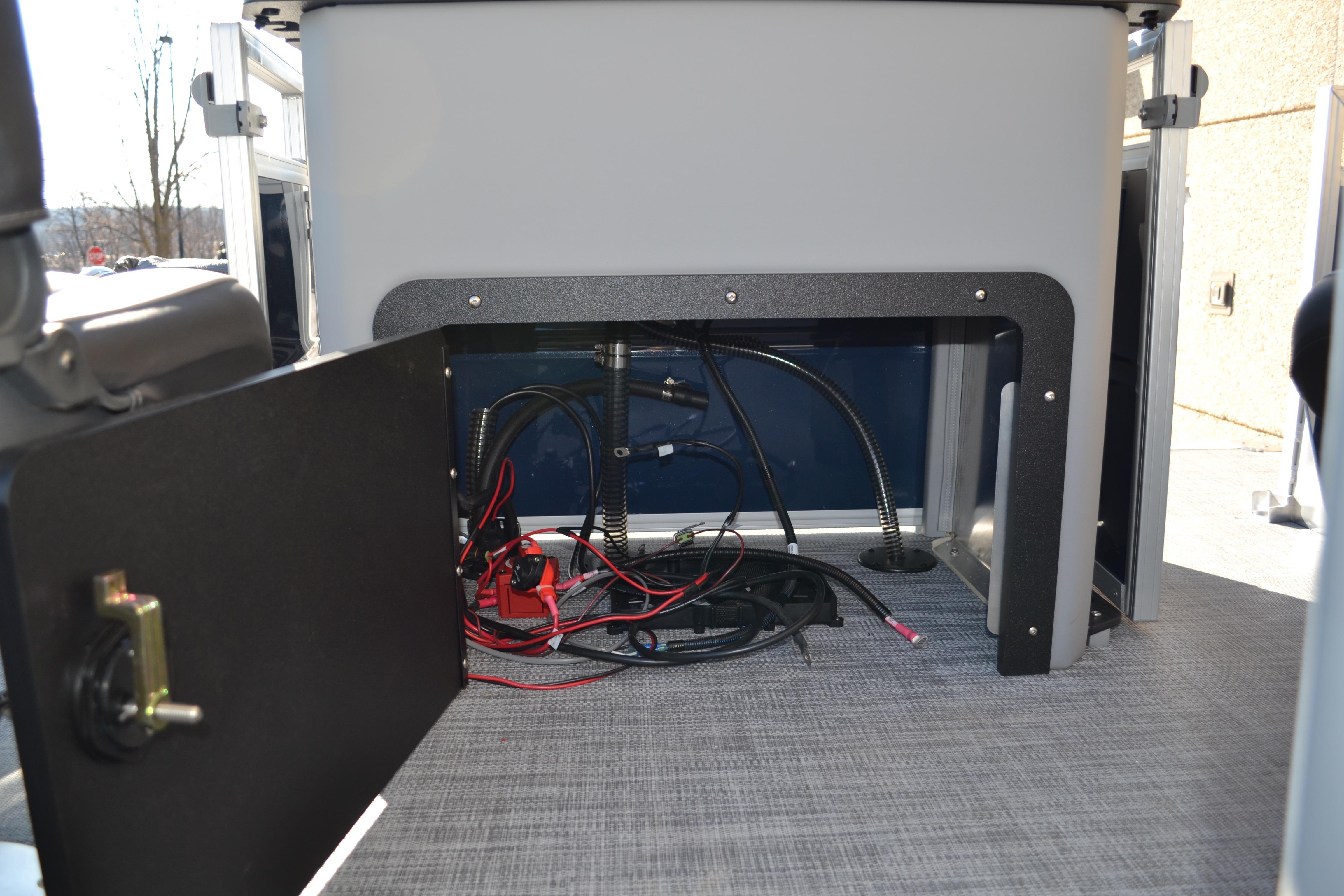 2026 Sun Tracker SportFish 22 XP3 boat interior wiring and storage compartment.