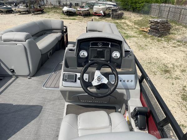 2023 Regency 250DL3 boat interior with steering console and seating.