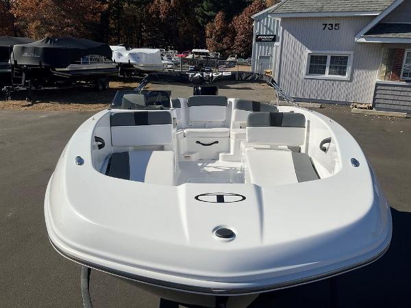 2025 Tahoe T18 boat with sleek white design, parked outdoors.