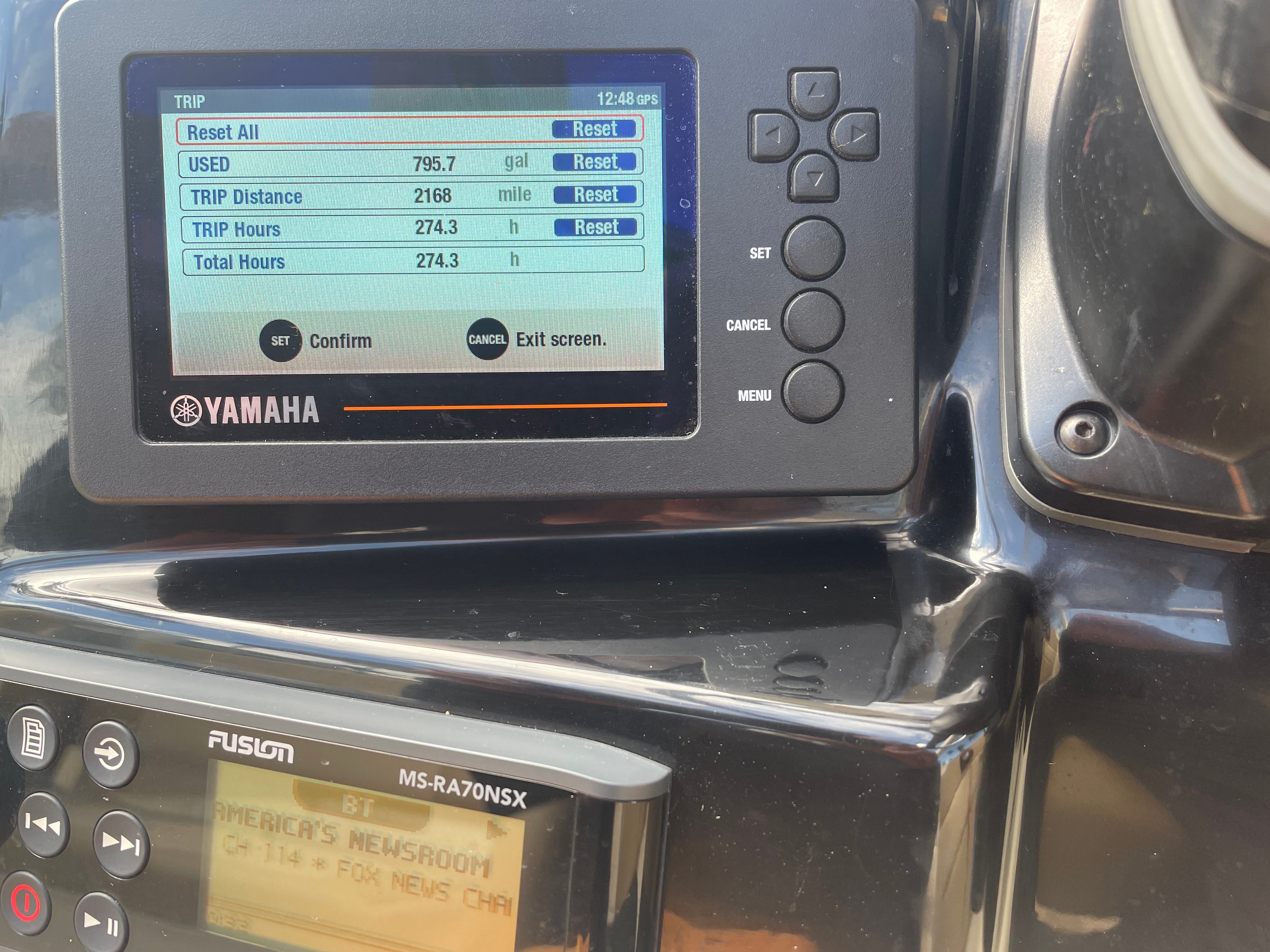 Close-up of a Yamaha display on a Scout 235 Dorado boat, showing fuel usage and trip data.