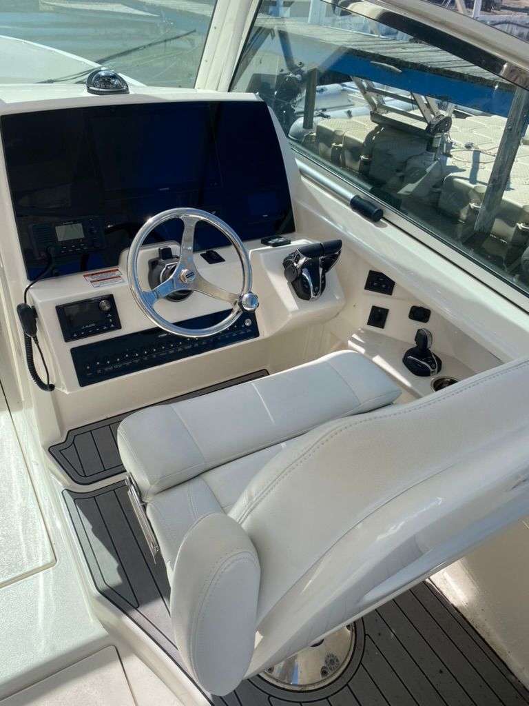 Interior view of a 2023 Cobia 330 boat cockpit.