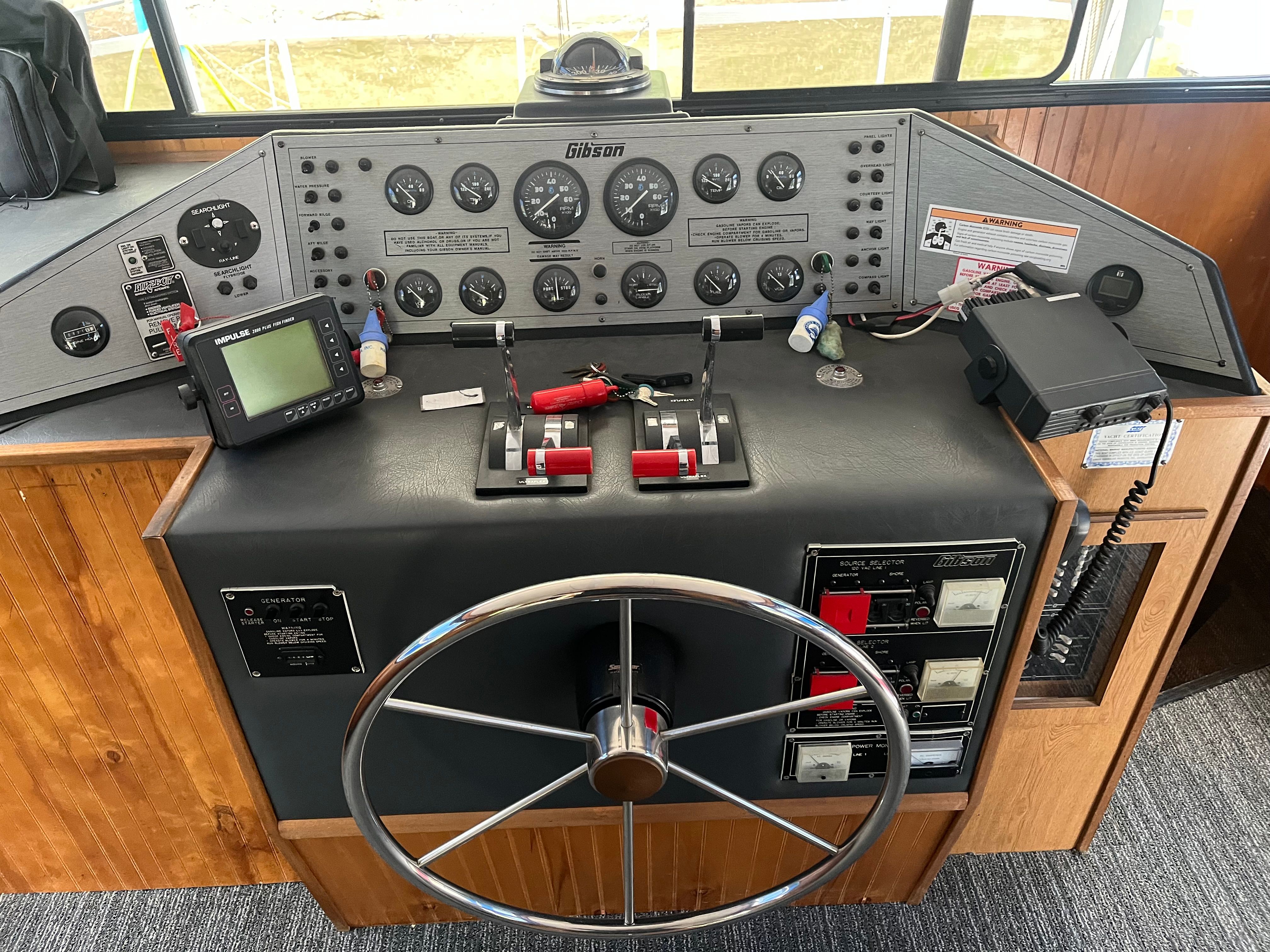 The image shows the helm of a 1995 Gibson Executive boat with various instruments.
