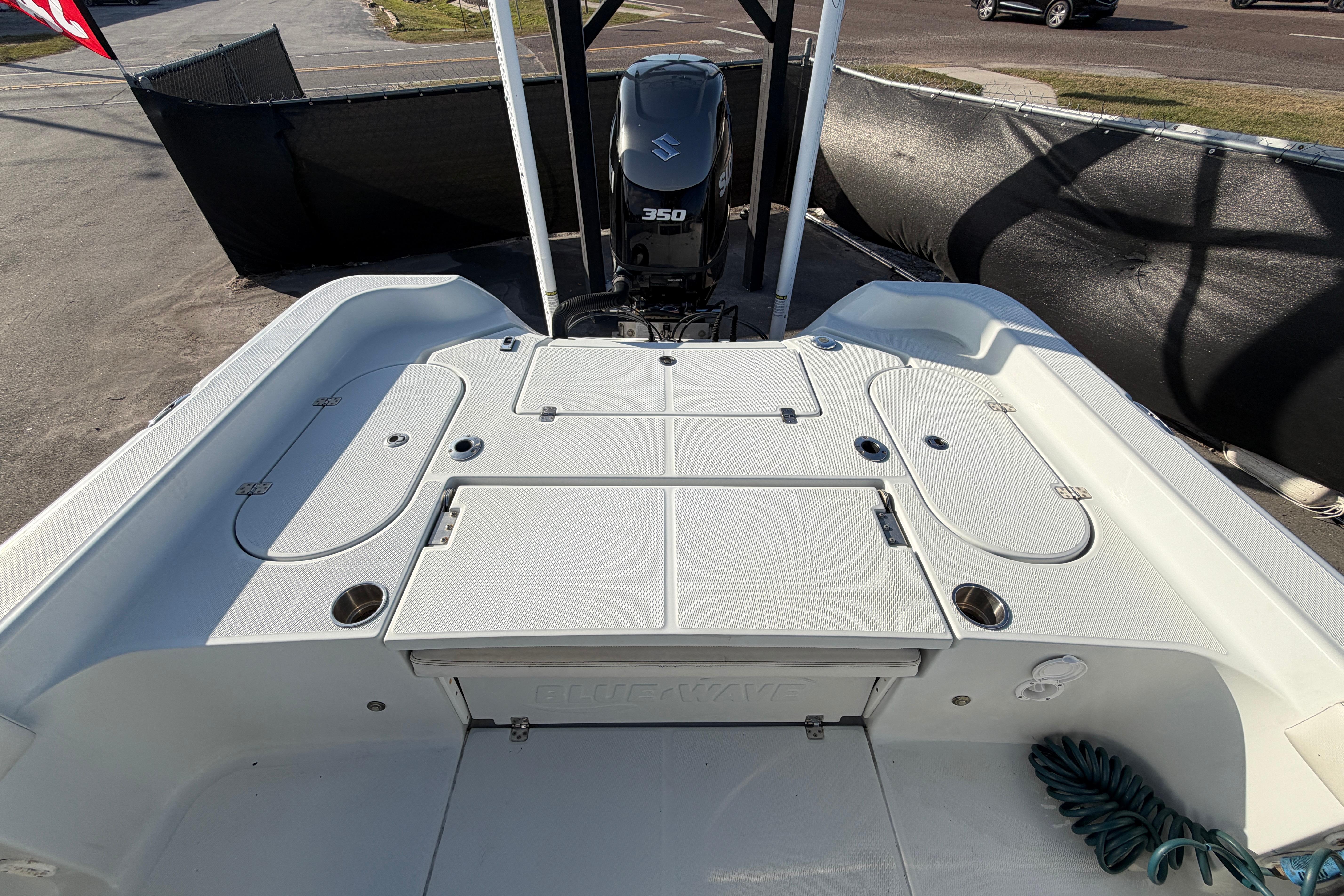 2018 Blue Wave 2800 Pure Hybrid boat with Suzuki 350 engine, rear deck view.