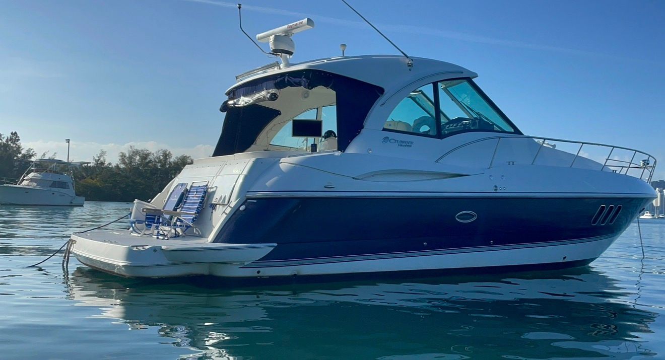 2012 Cruisers Yachts 430 Sports Coupe on calm water.