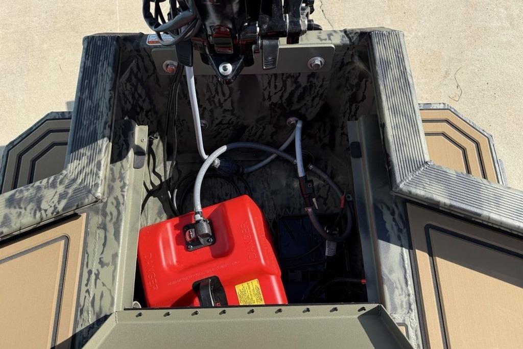 2026 Tracker Grizzly 1650 T Prairie Wings Edition boat interior with red fuel tank.