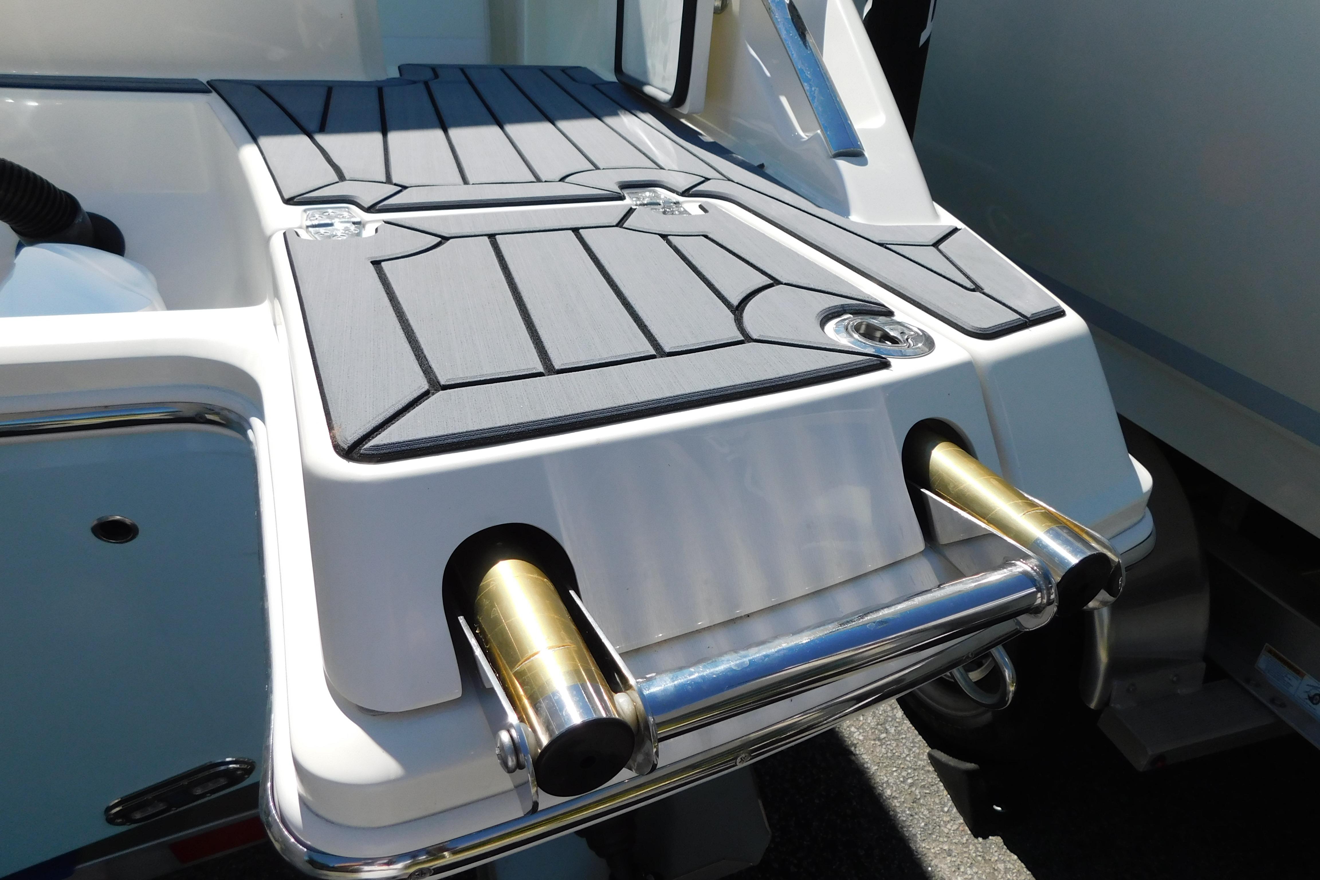 2026 Cobia 240 Dual Console boat with sleek deck design and stainless steel fittings.