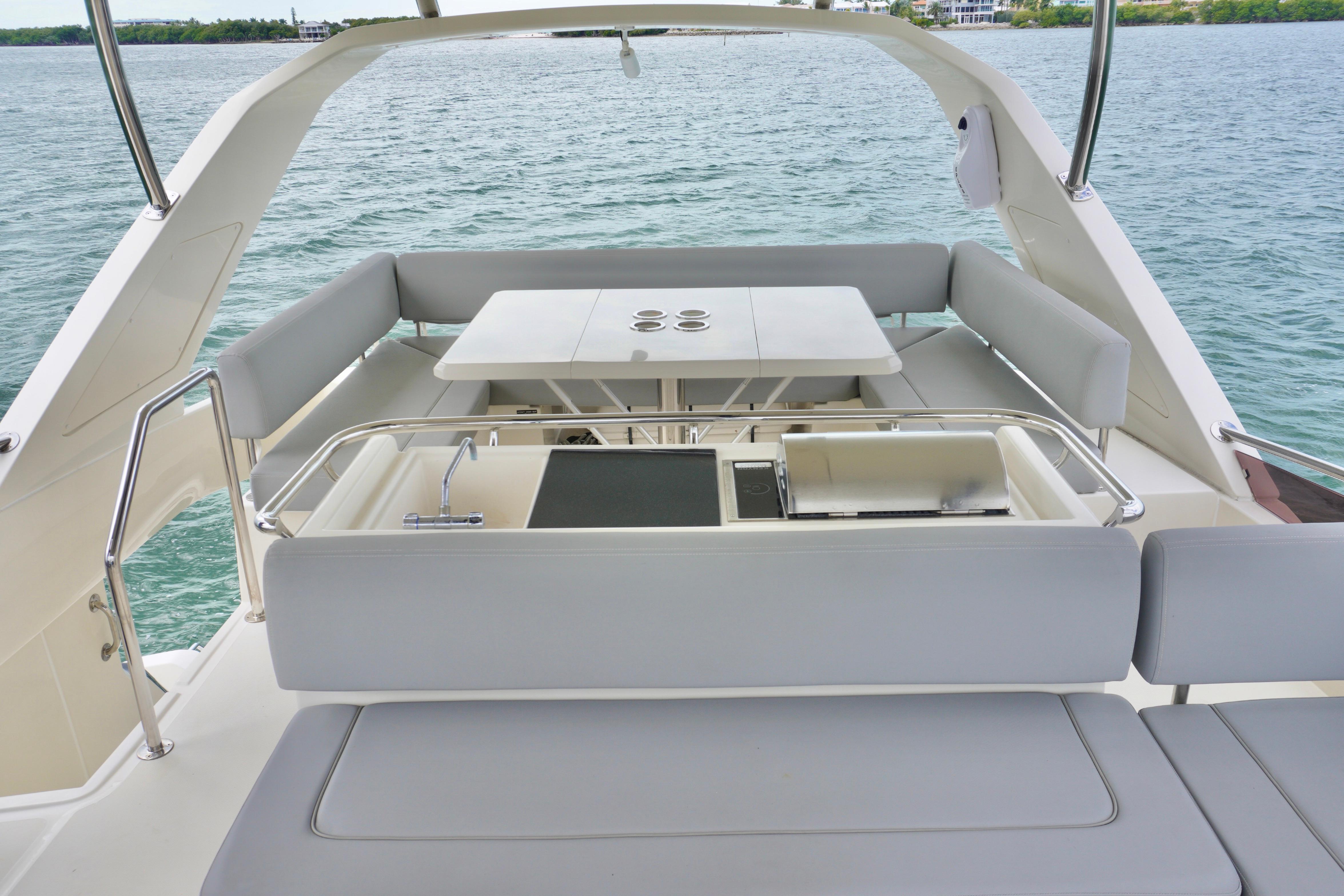 Luxurious 2017 Aquila 44 Yacht with spacious outdoor seating and dining area.