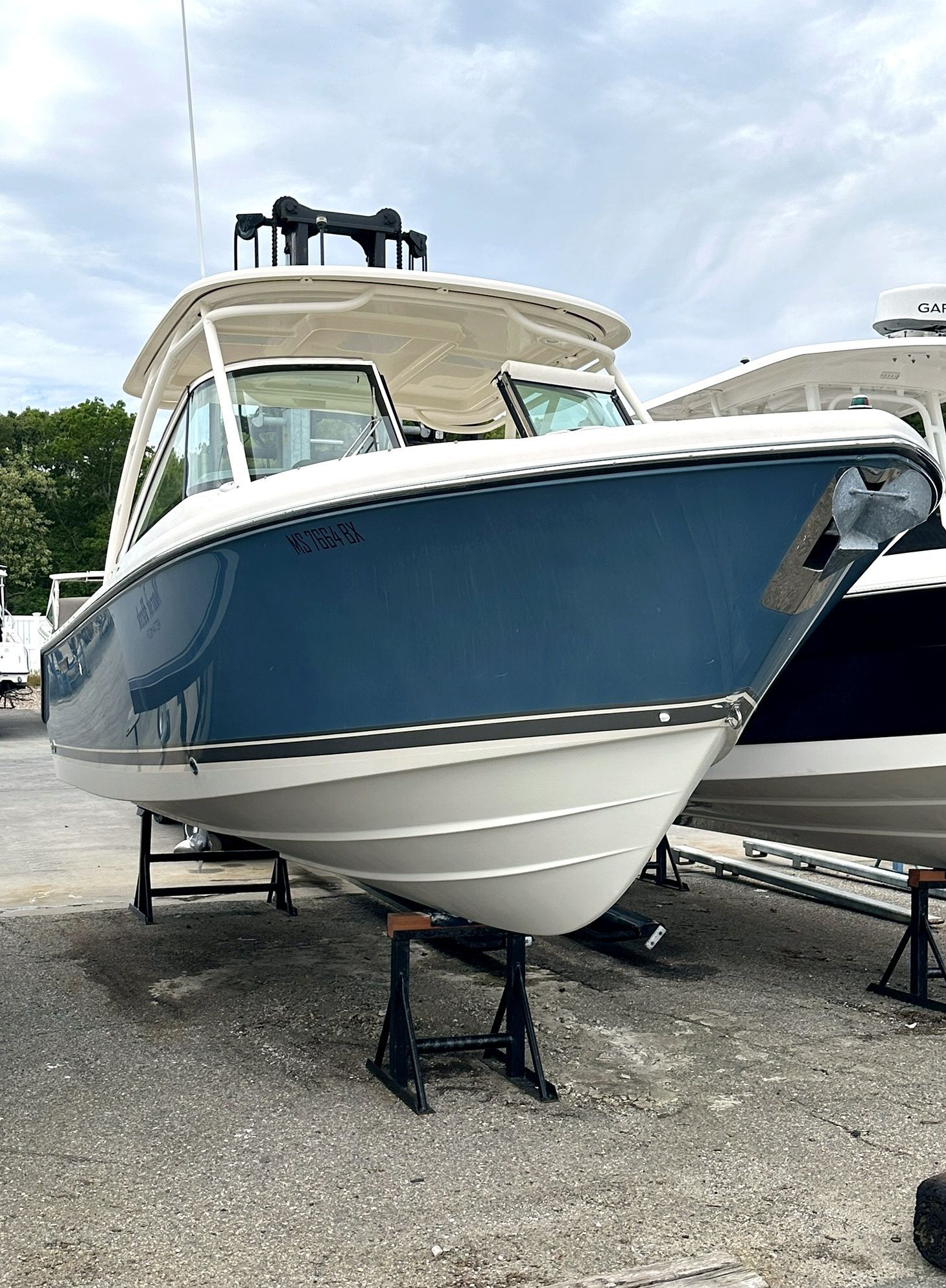 2012 Pursuit DC 265 Dual Console on stands at the harbor.