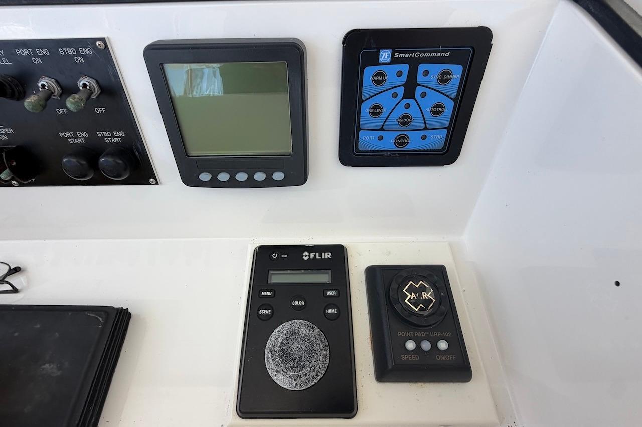 Control panel of a 2012 Viking 50 Convertible yacht with navigation and monitoring systems.