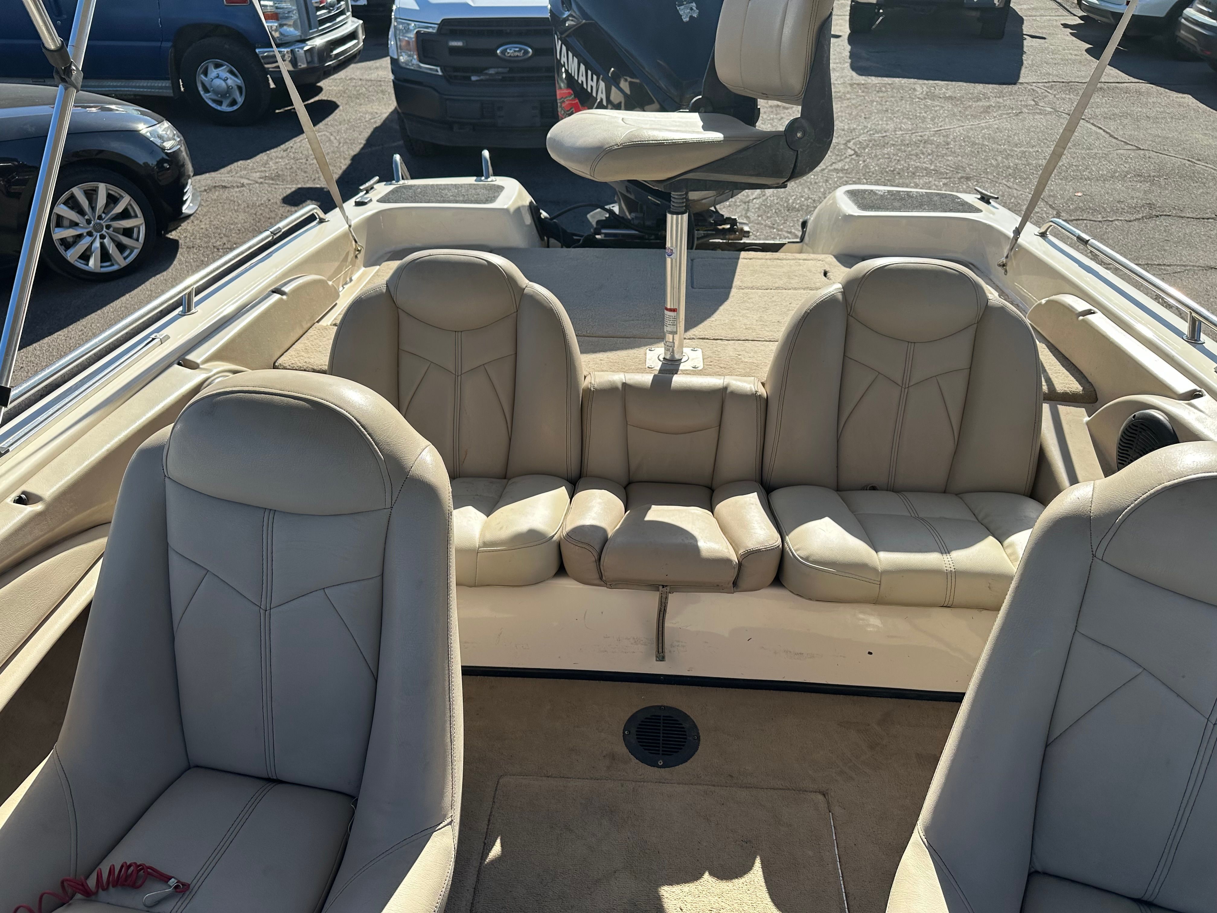 Interior view of a 2008 Skeeter SL 210 boat with beige leather seats.