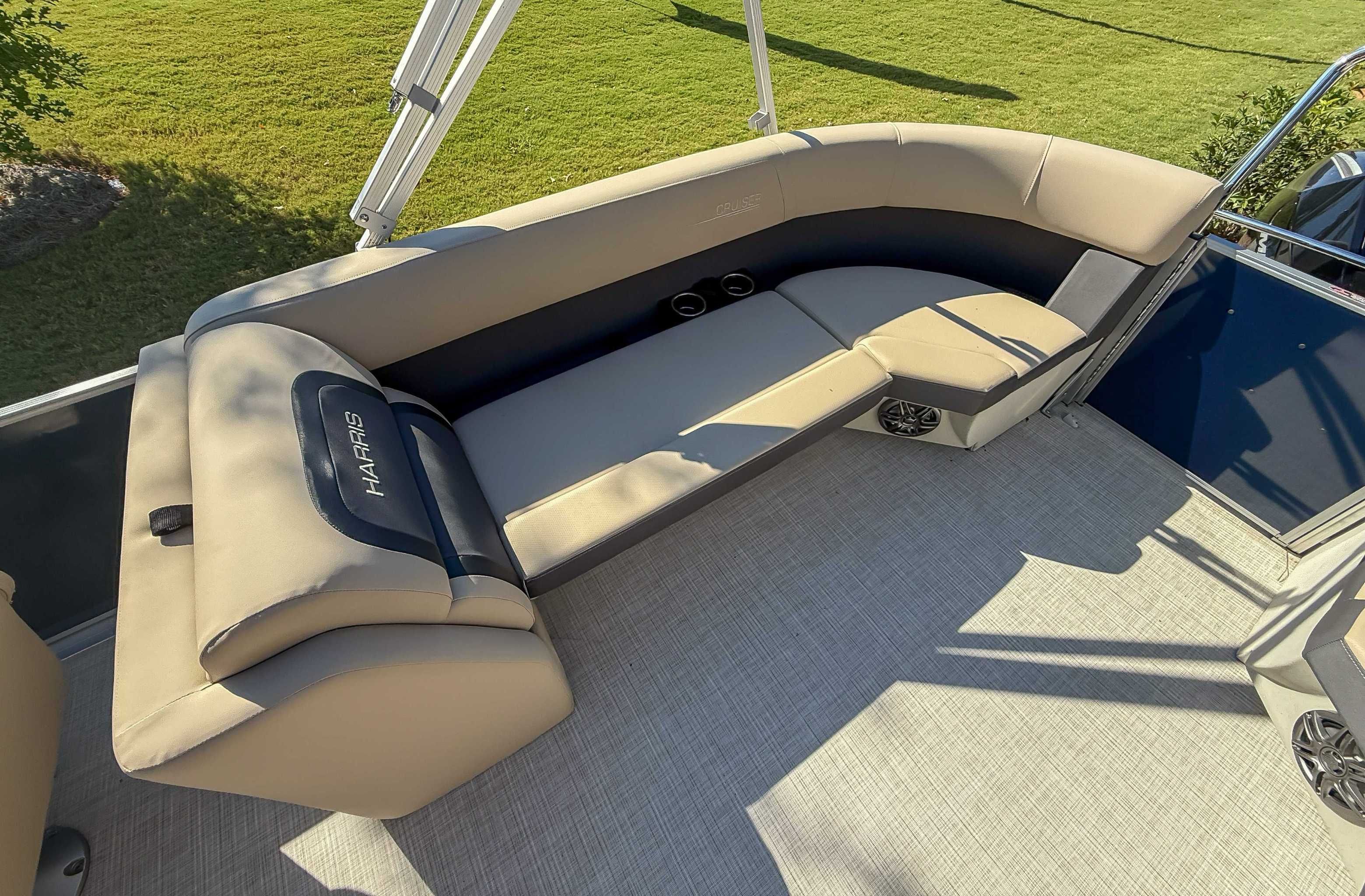 Interior of 2025 Harris Cruiser 250 CWDH with beige seating.