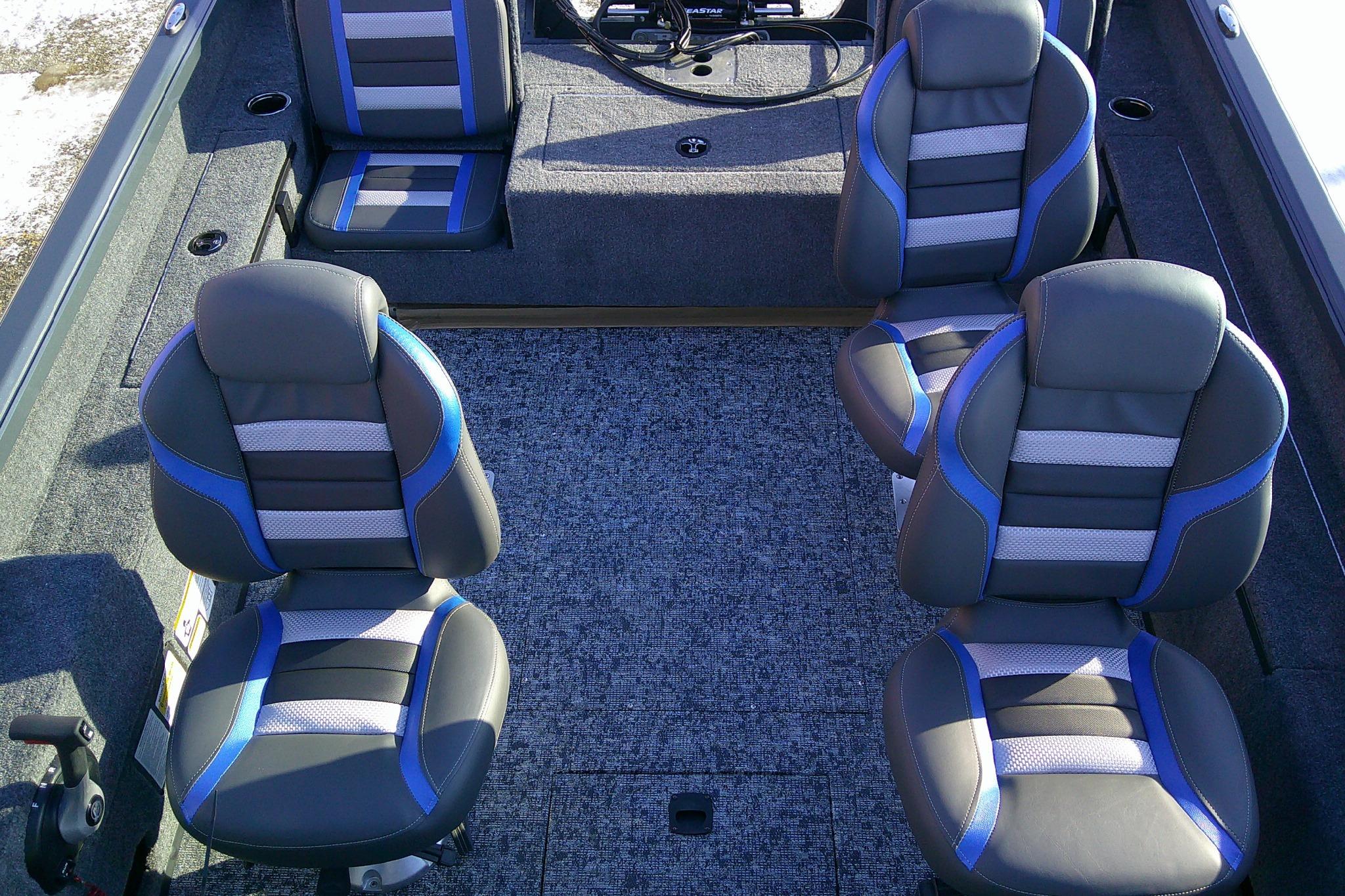 2026 Ranger VS1882SC Reata boat interior with four cushioned seats and carpeted flooring.