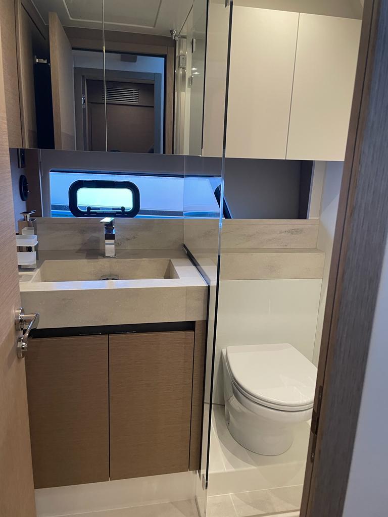 Luxurious bathroom on a 2022 Prestige 520 yacht.