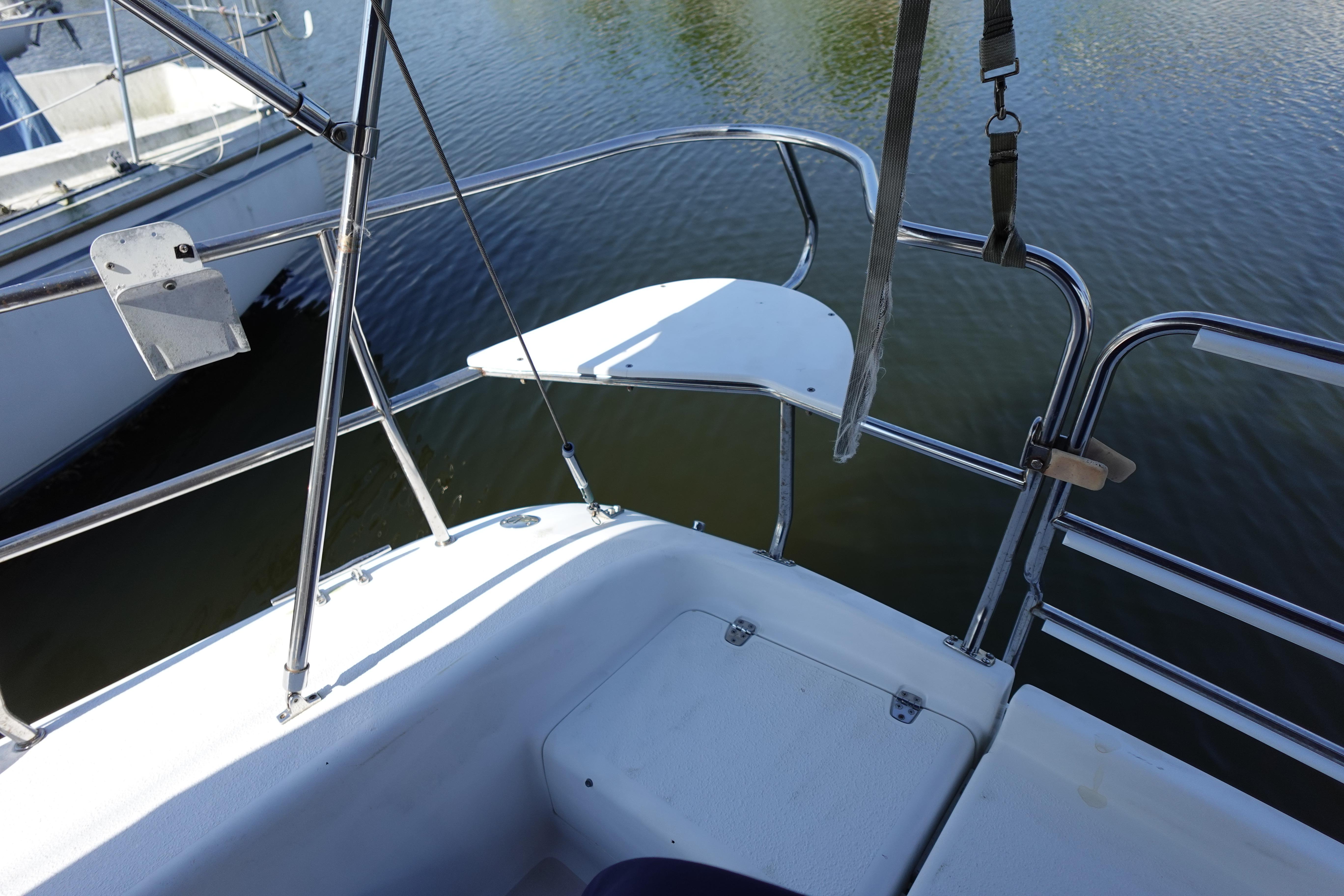 Cockpit view of a 1997 Catalina 28 sailboat with stainless steel railings.