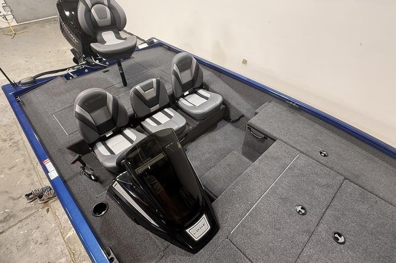 2026 Lowe Stinger 175C boat interior with gray seating and carpeted deck.