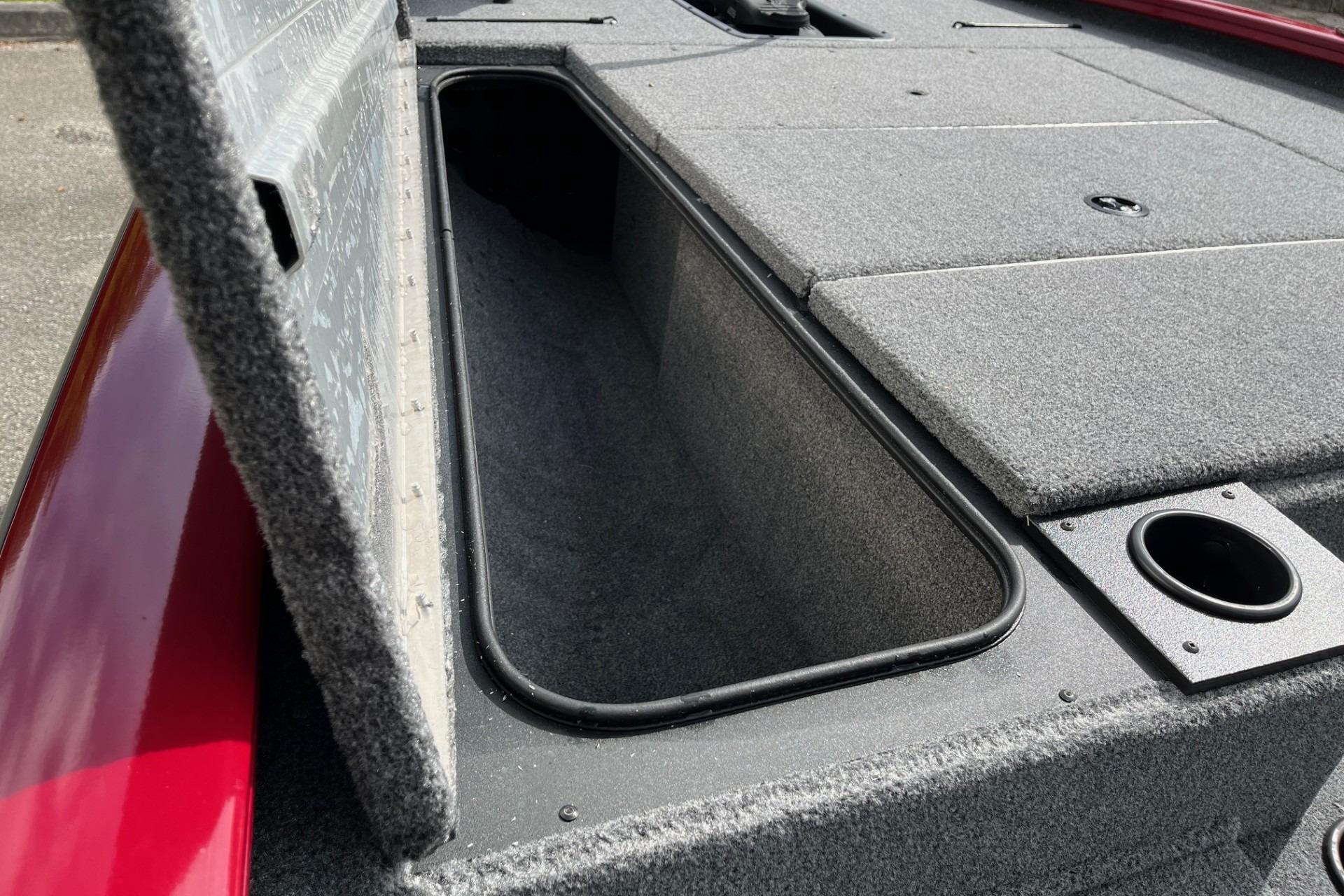 2025 Tracker Pro Team 195 Tournament Edition boat storage compartment, open lid view.