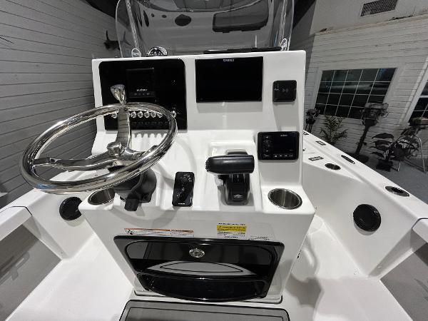 2025 Sea Pro 210 Bay boat console with steering wheel and controls.