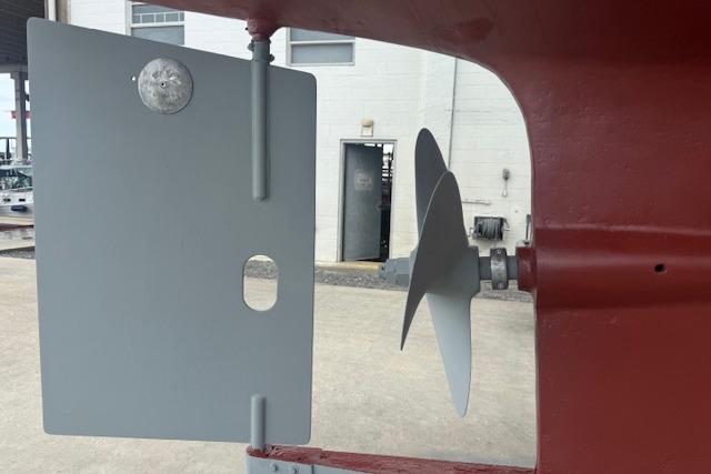 Rudder and propeller of a 1986 Kadey-Krogen 42 boat in a shipyard.
