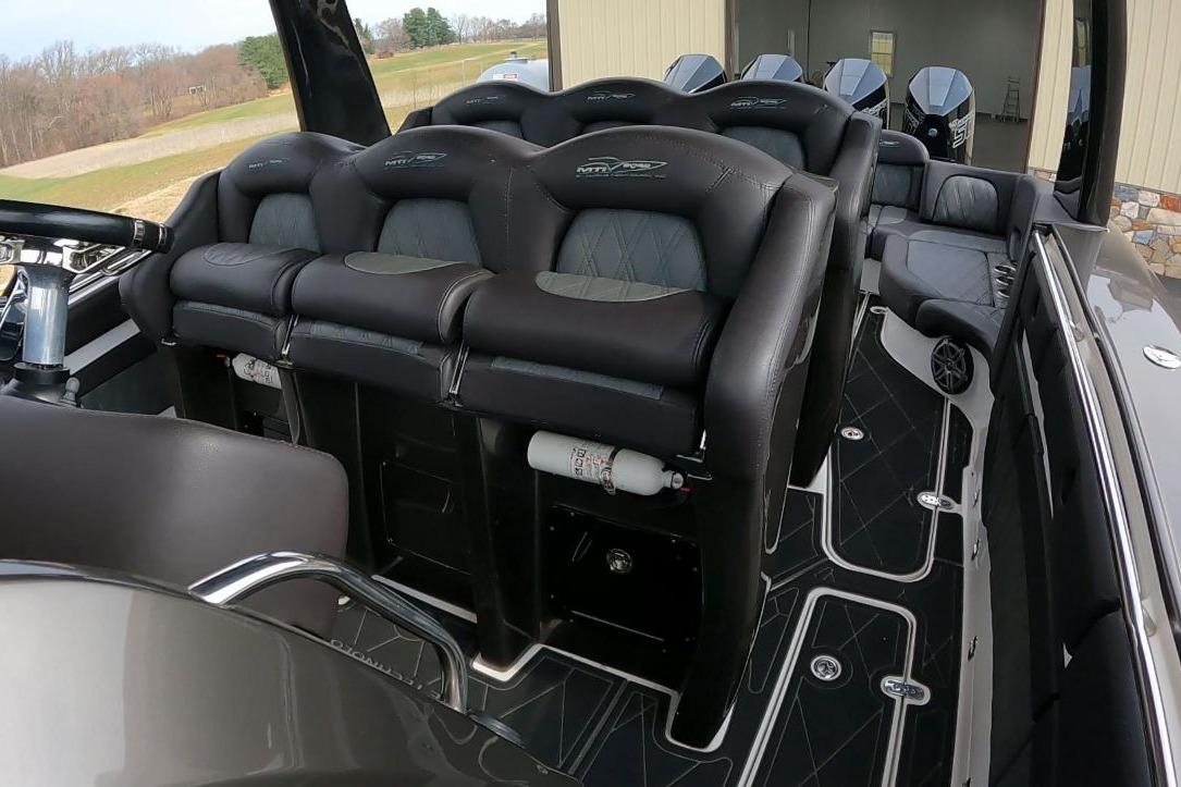 Luxury MTI V42 boat interior with plush seating, sleek design, and modern features, 2018 model.