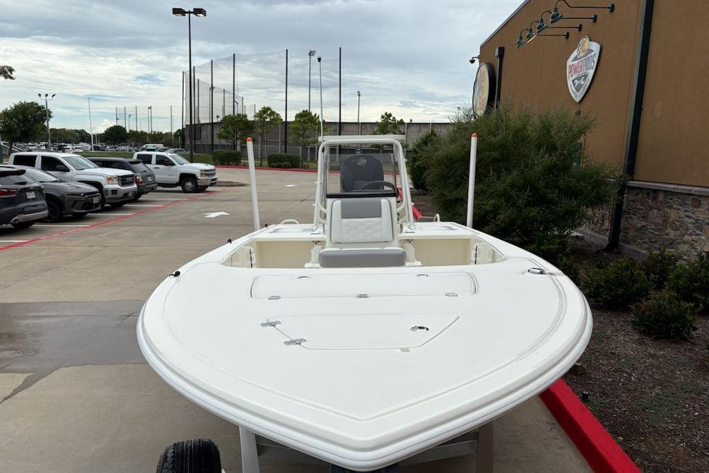 2026 Mako 18 Pro Skiff boat parked outdoors near a building.