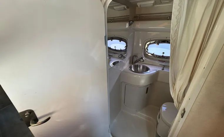 Interior view of 2010 Sea Ray Sundancer 260 yacht bathroom.
