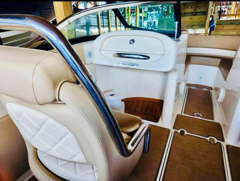 2016 Chris-Craft Carina 21 interior with beige leather seats and elegant design.