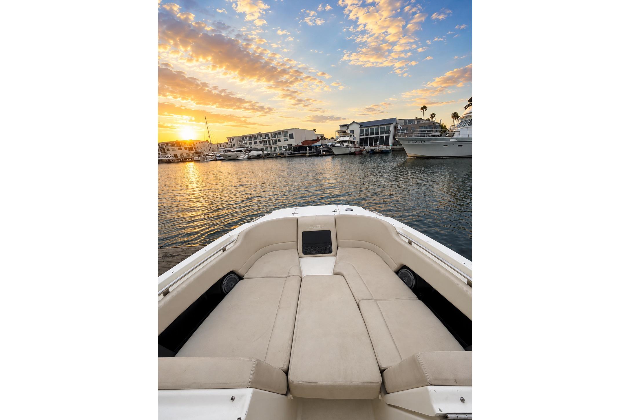 Boston Whaler 230 Vantage 2017 boat interior with sunset view over marina.