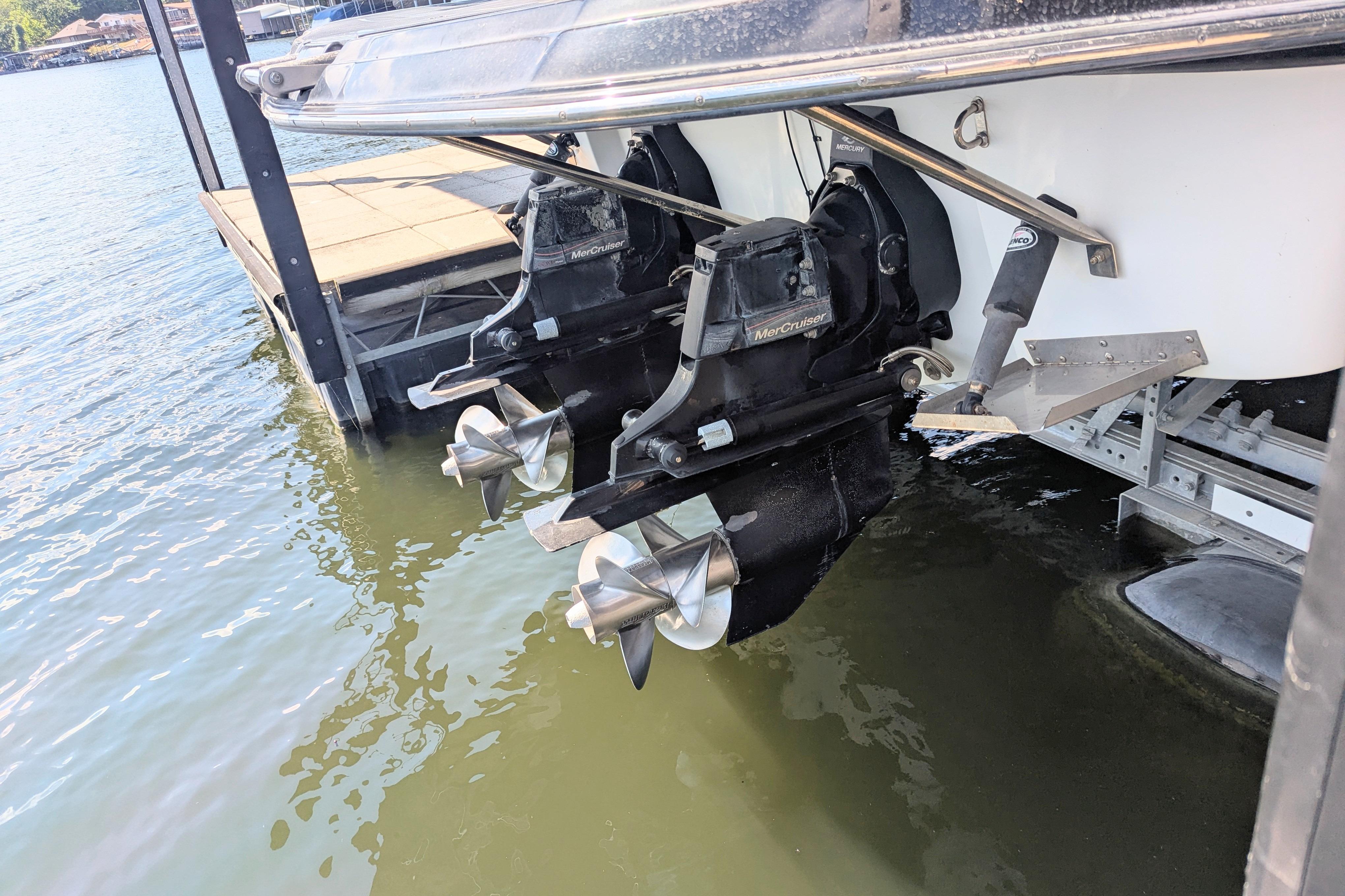 2008 Crownline 300 LS boat with dual MerCruiser outdrives at dockside.