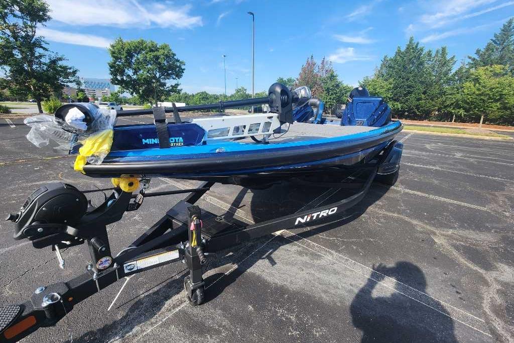 2025 Nitro Z21 XL boat on trailer in parking lot, sunny day.