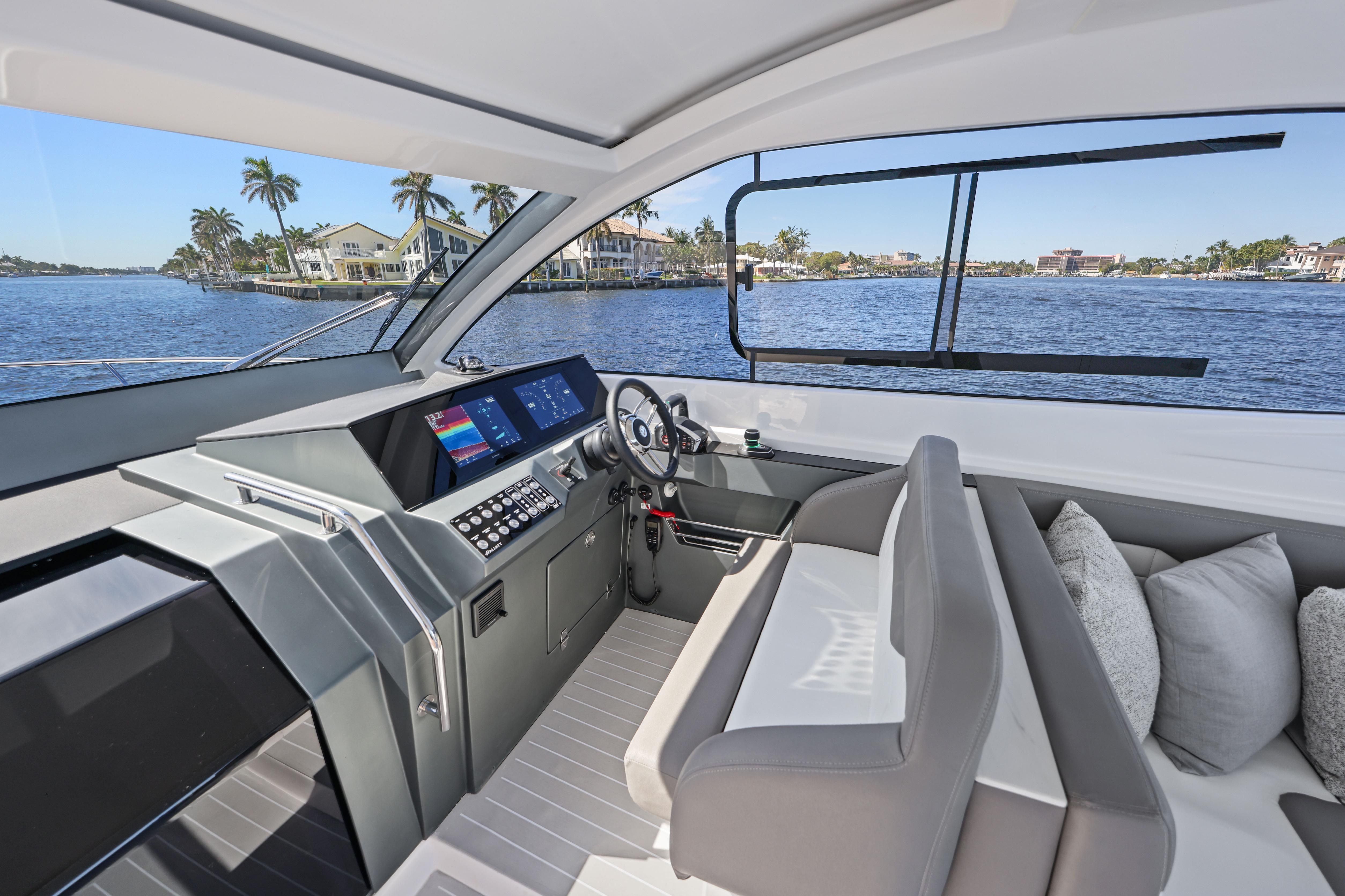 2025 VALIATT YACHTS 380 Bowrider interior with modern helm and waterfront view.