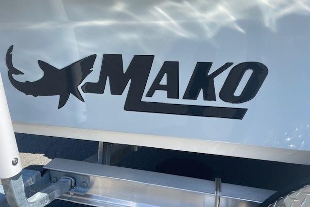 2026 Mako 18 Pro Skiff logo on boat hull, featuring shark silhouette.