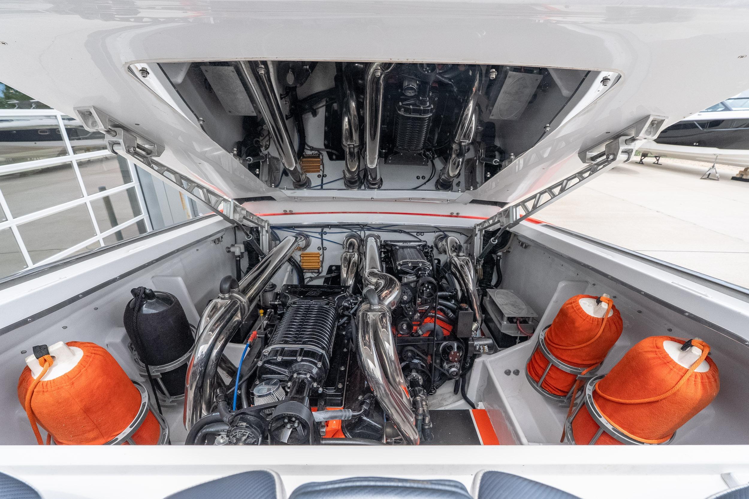 Engine compartment of a 2006 Cigarette 39' Top Gun Unlimited boat, showcasing powerful machinery.