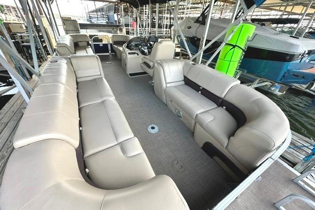 2019 Sun Tracker Party Barge 22 XP3 with spacious seating and modern design at a marina.