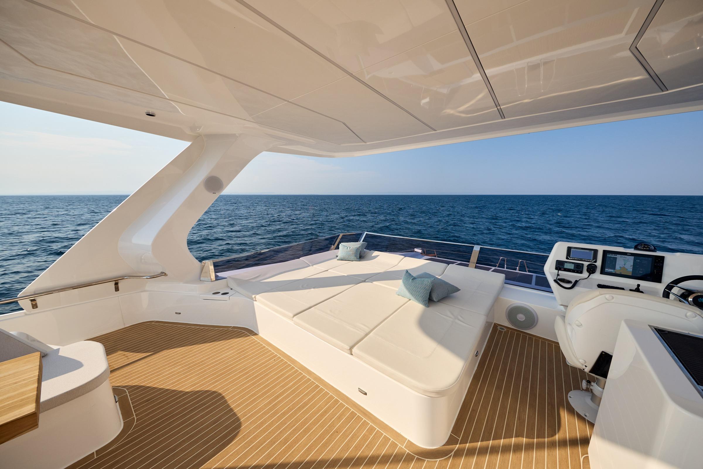 Luxurious 2025 Omaya 50 Power Catamaran deck with ocean view and modern seating.