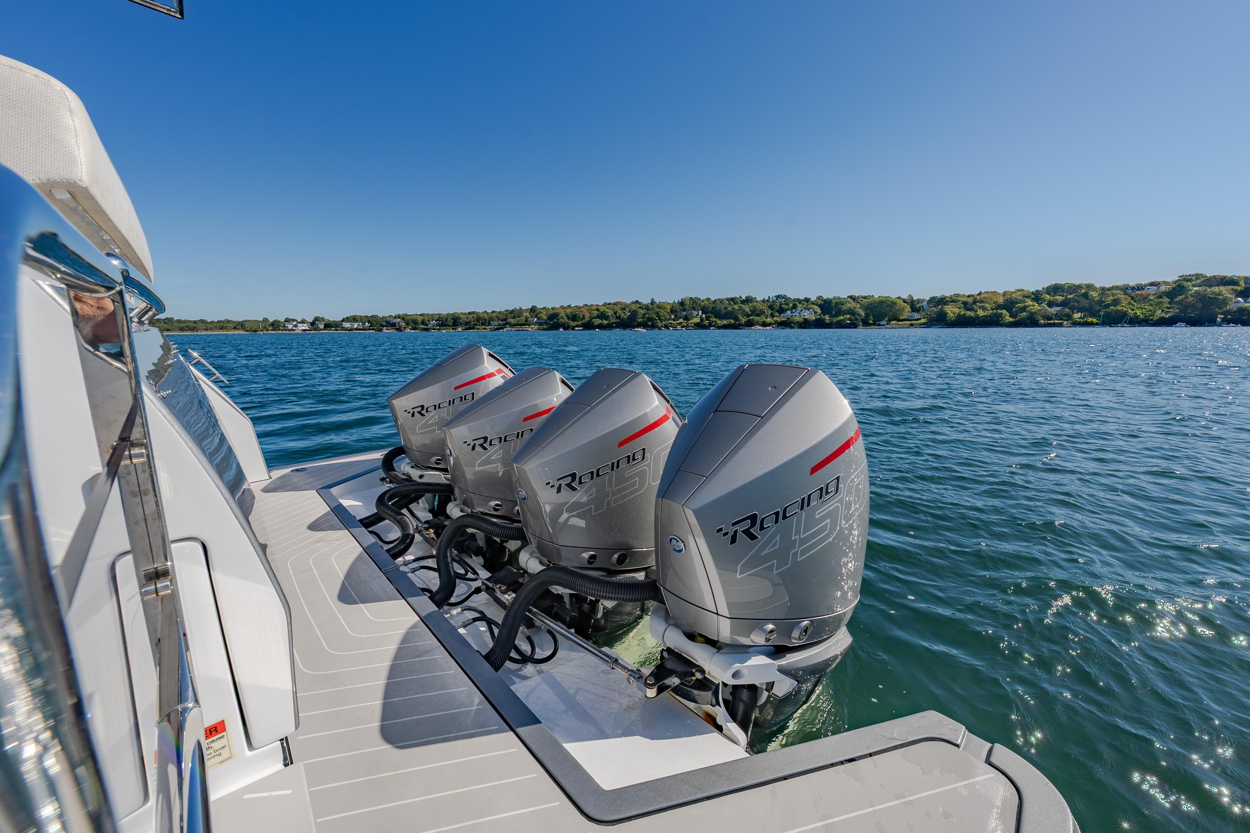 2023 Azimut Verve 47 with powerful outboard engines on a serene lake.