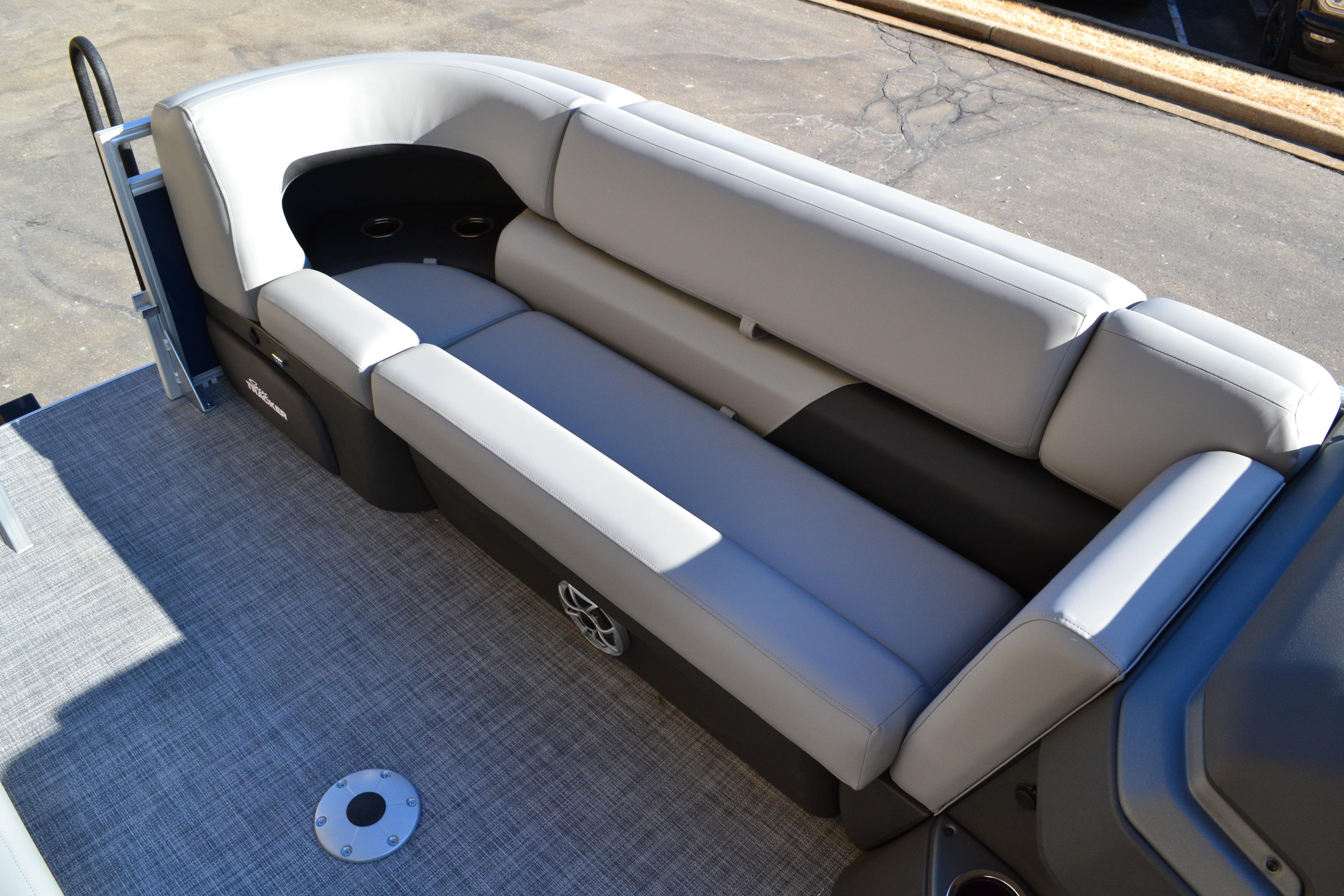 2026 Sun Tracker SportFish 22 XP3 boat interior with gray cushioned seating.