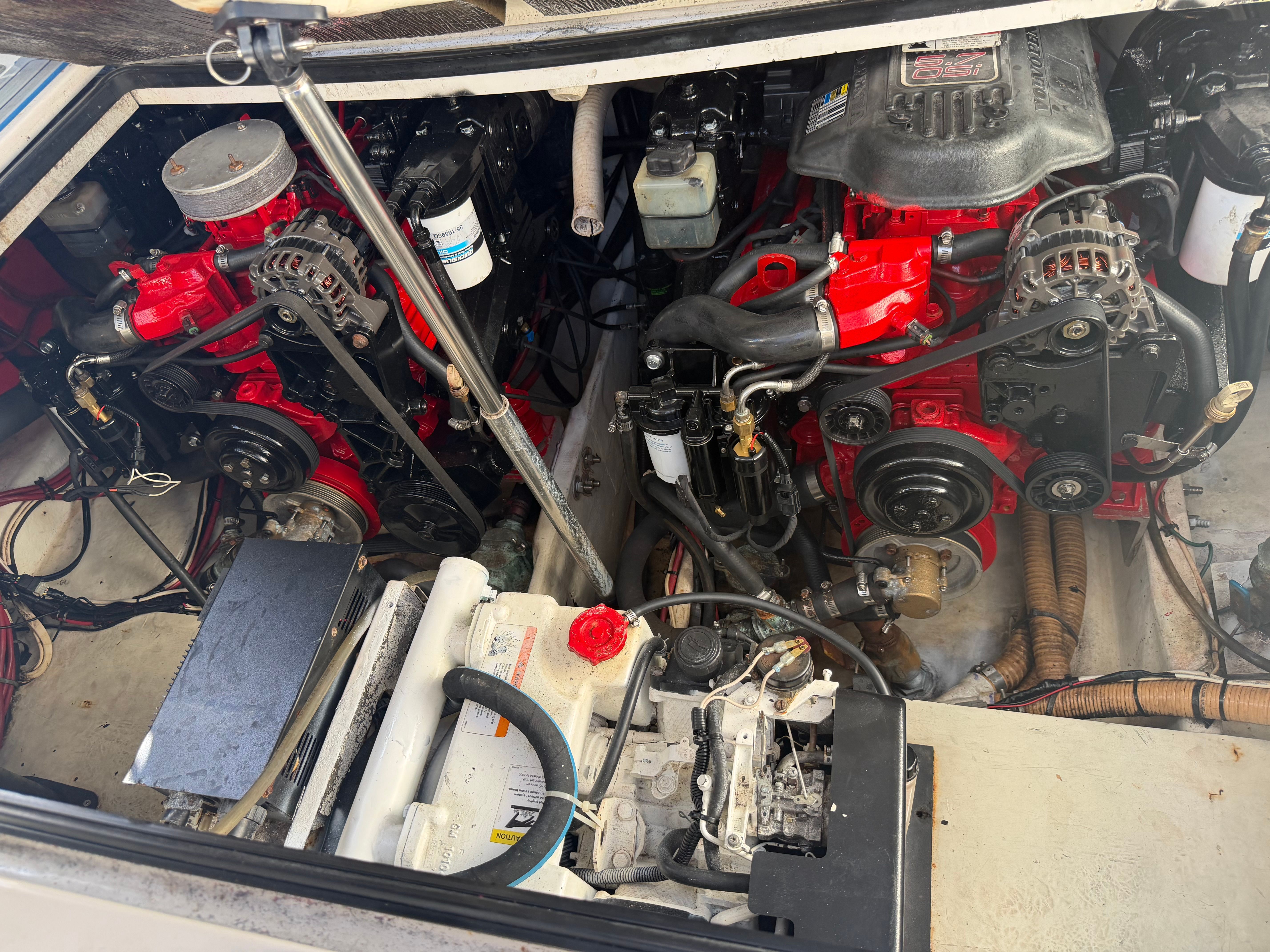 Engine compartment of a 2006 Four Winns 328 Vista boat with dual engines.