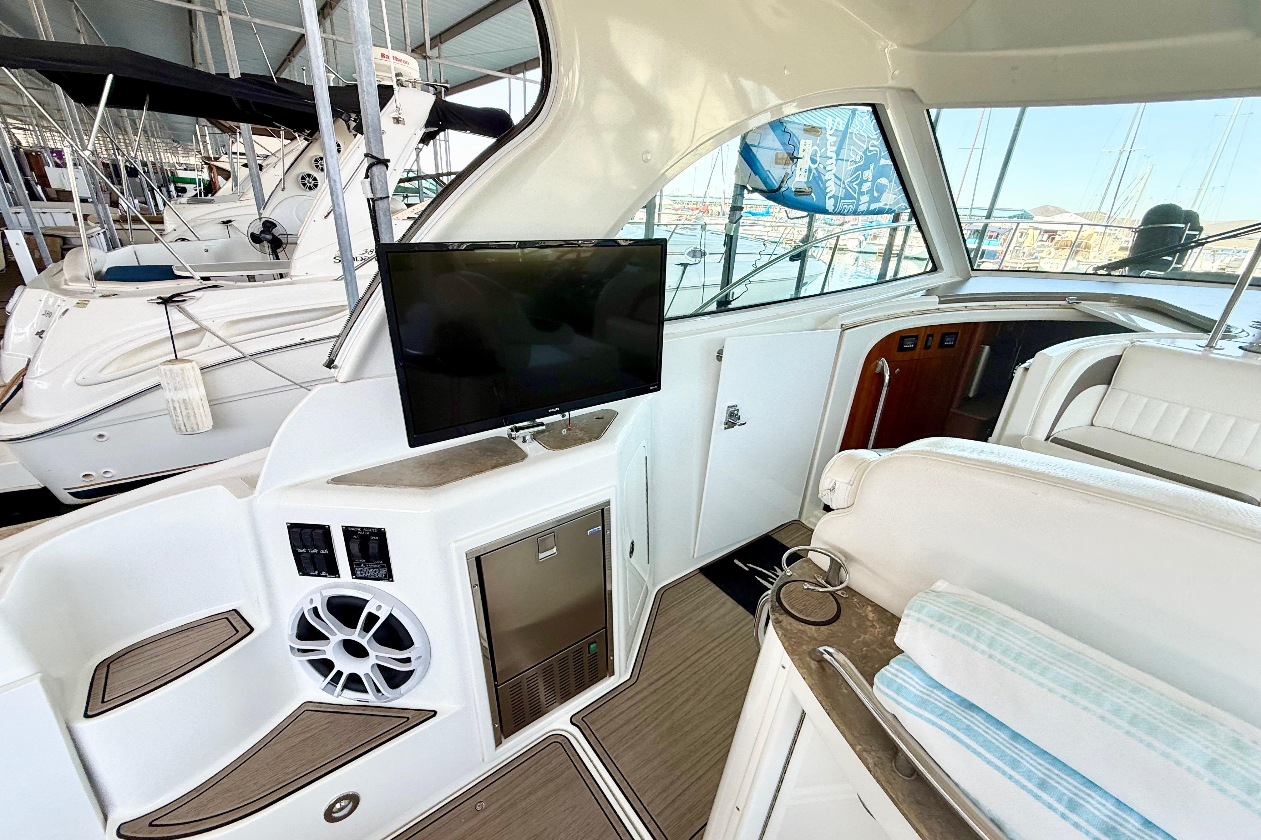 Interior of 2011 Cruisers Yachts 390 Sports Coupe with TV and seating area.