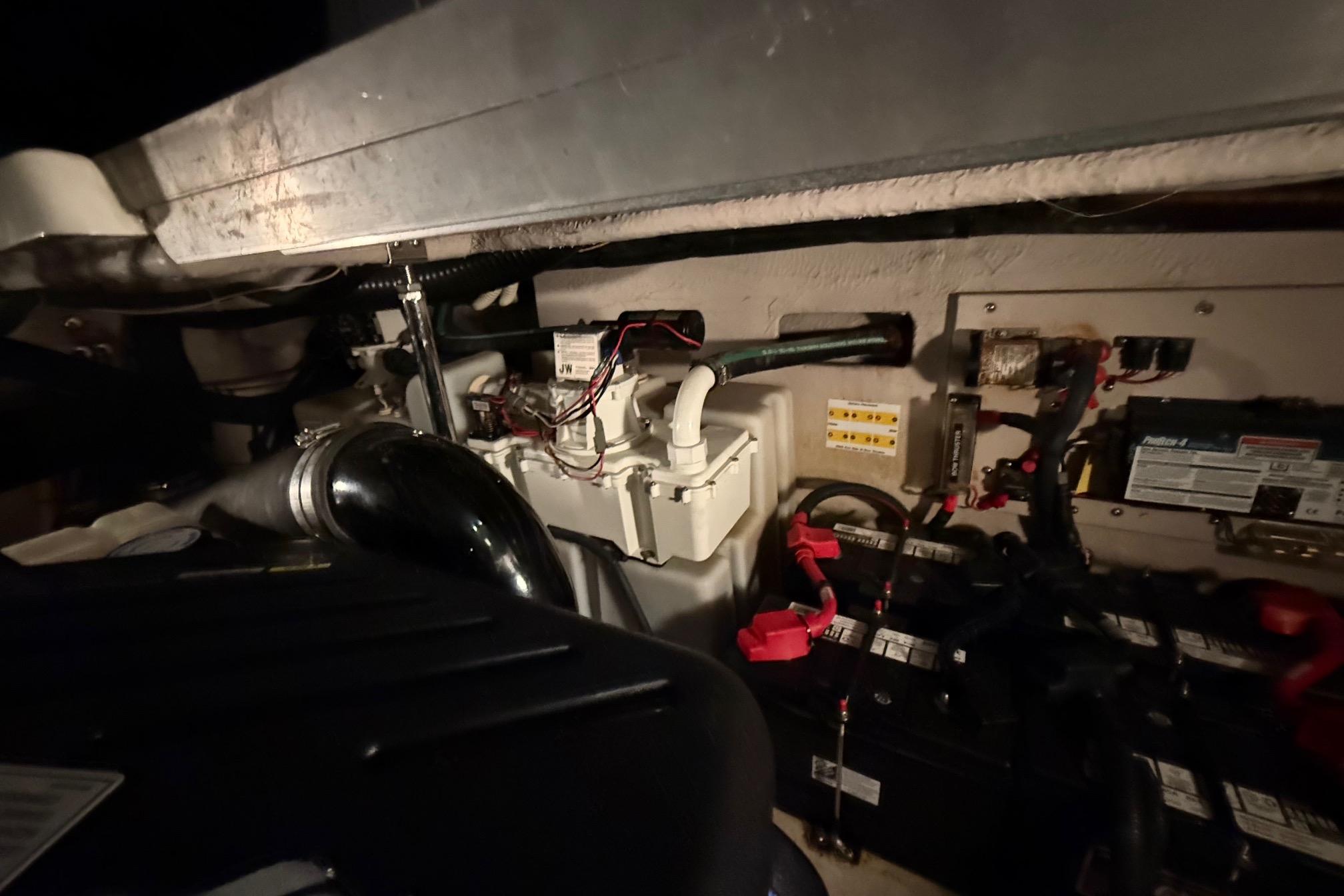 Engine compartment of a 2007 Sea Ray 40 Sundancer with visible wiring and components.