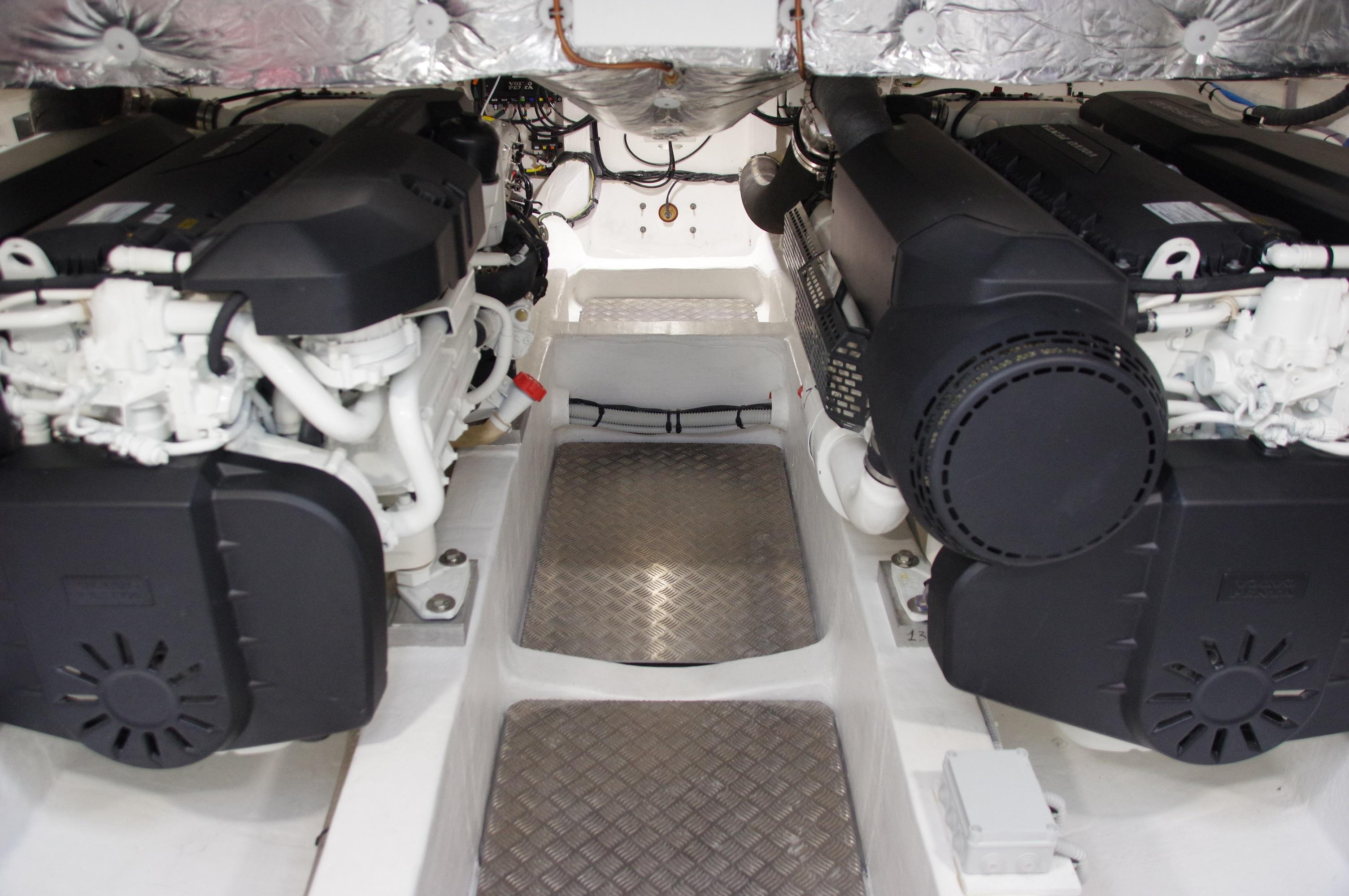 Engine room of 2025 Pardo Yachts 50, featuring dual engines and metallic flooring.