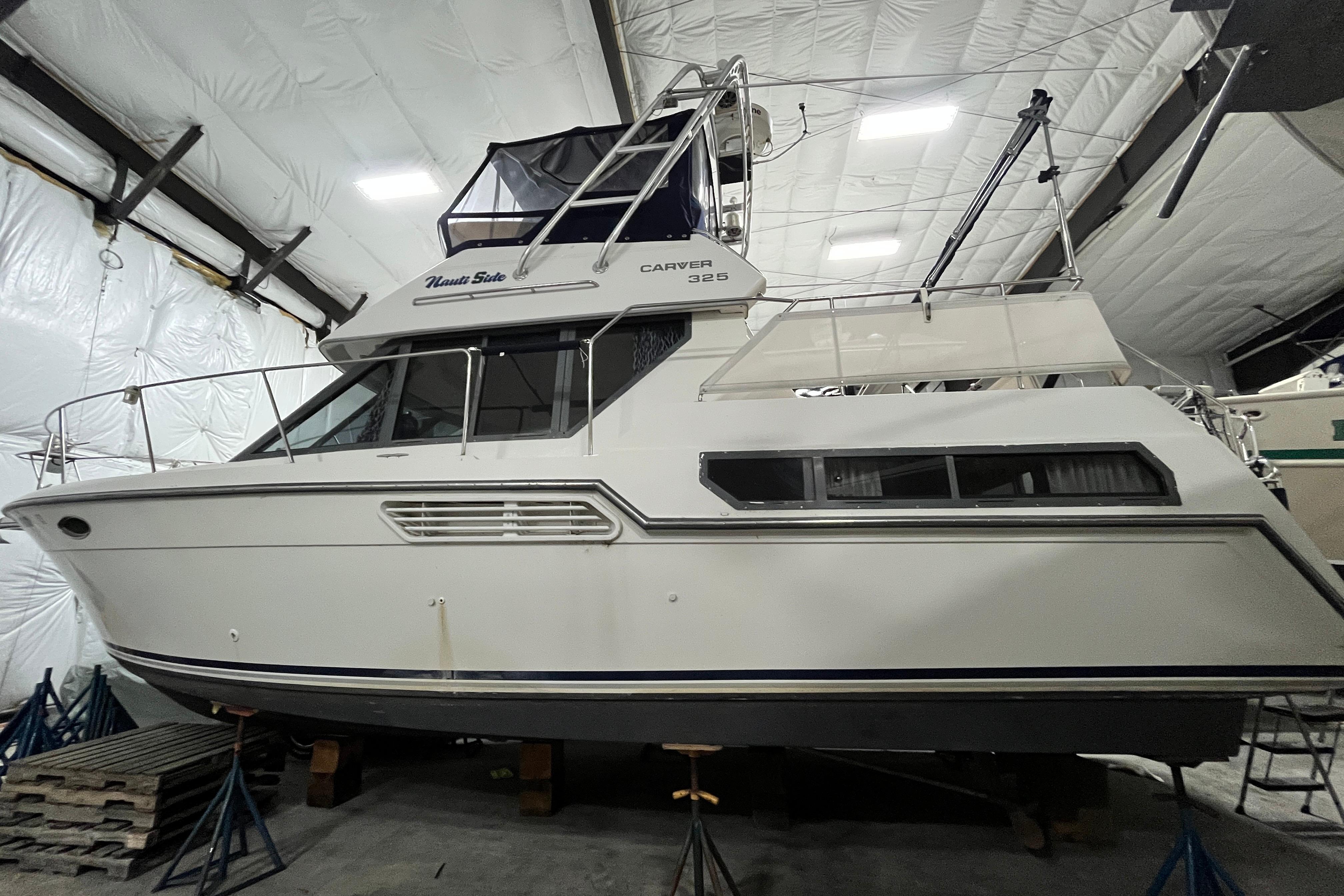 1995 Carver 325 Aft Cabin Motor Yacht in indoor storage facility.